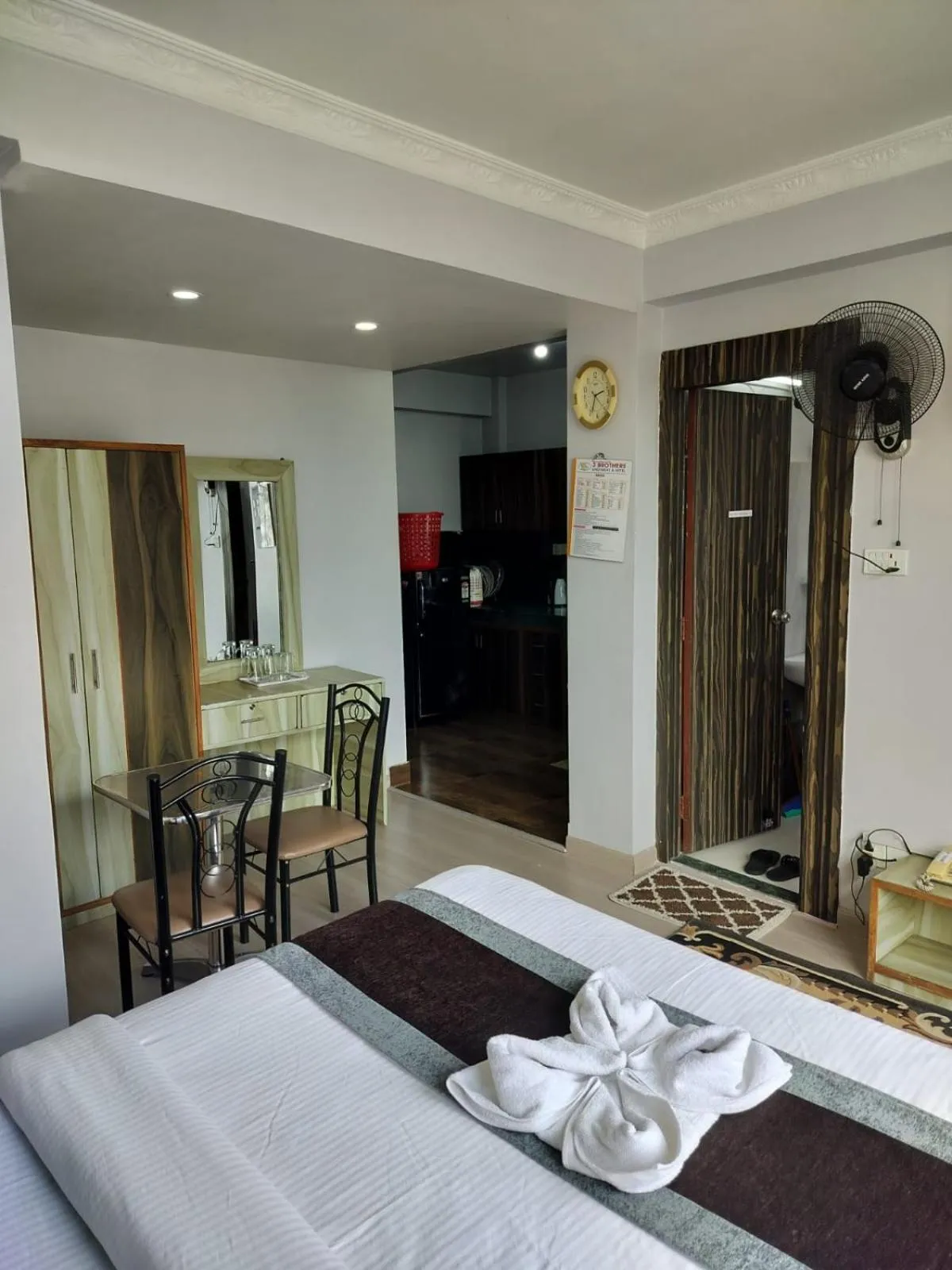 Bed in Three Brothers Apartment and Hotel