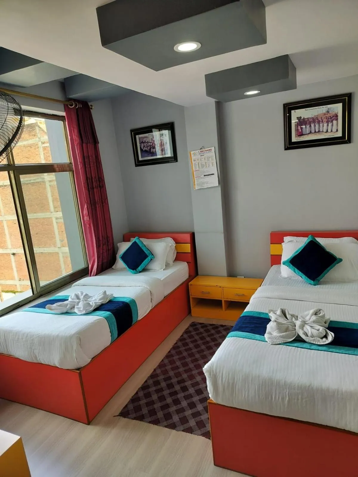 Bed in Three Brothers Apartment and Hotel