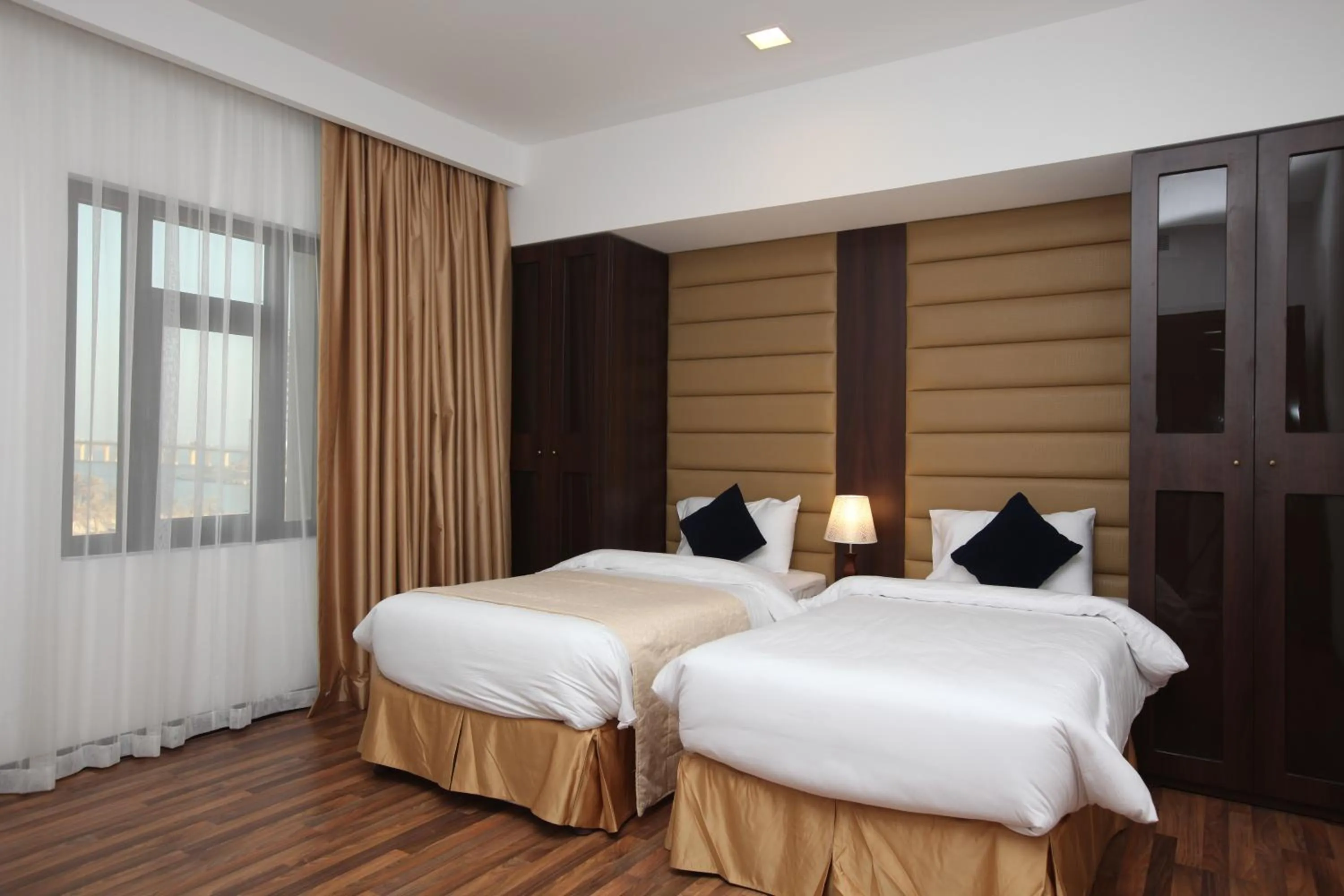 Bed in Golden Tulip Al Khobar Suites