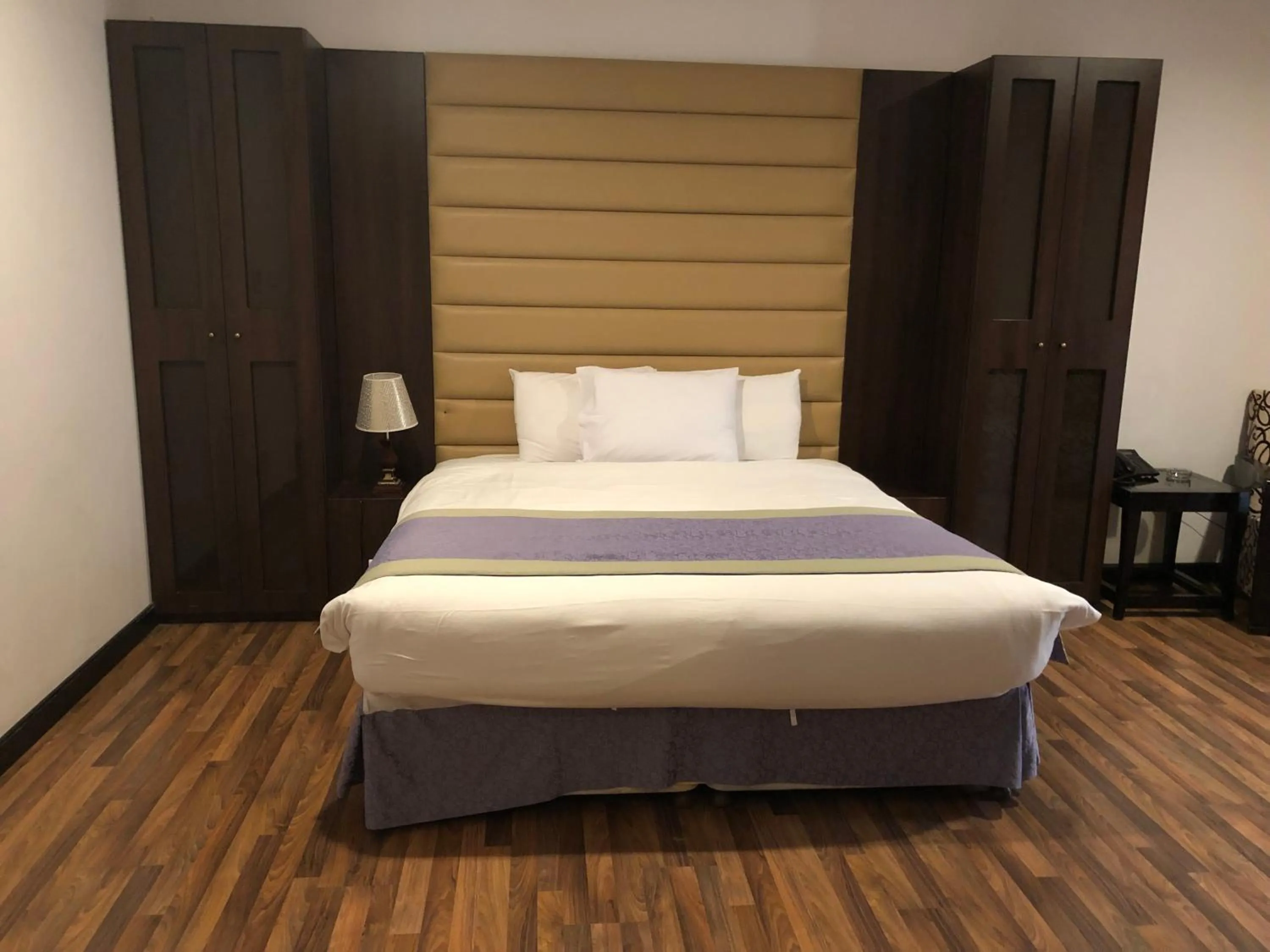 Bed in Golden Tulip Al Khobar Suites