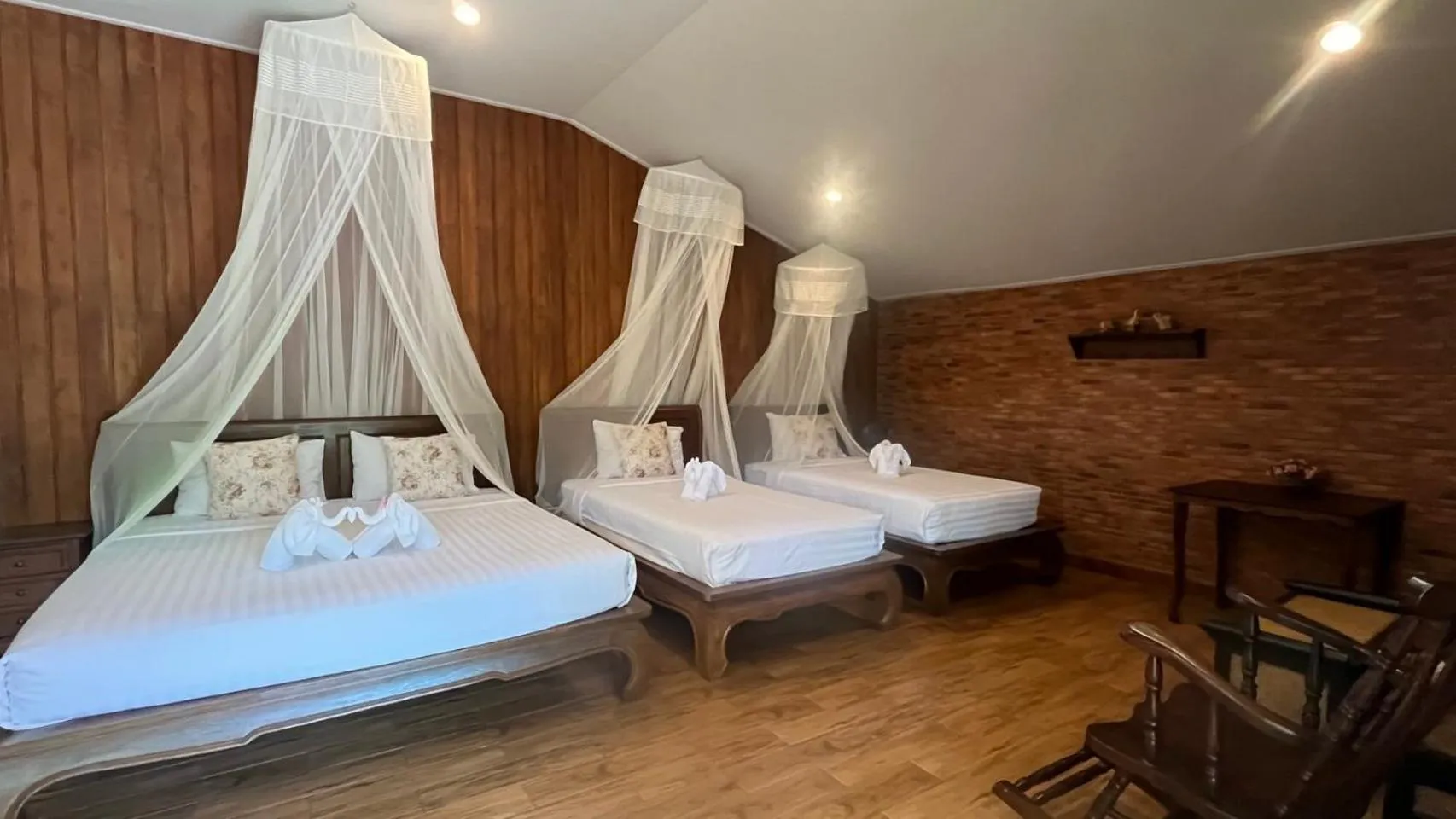 Bed in Sawasdee Sukhothai Resort