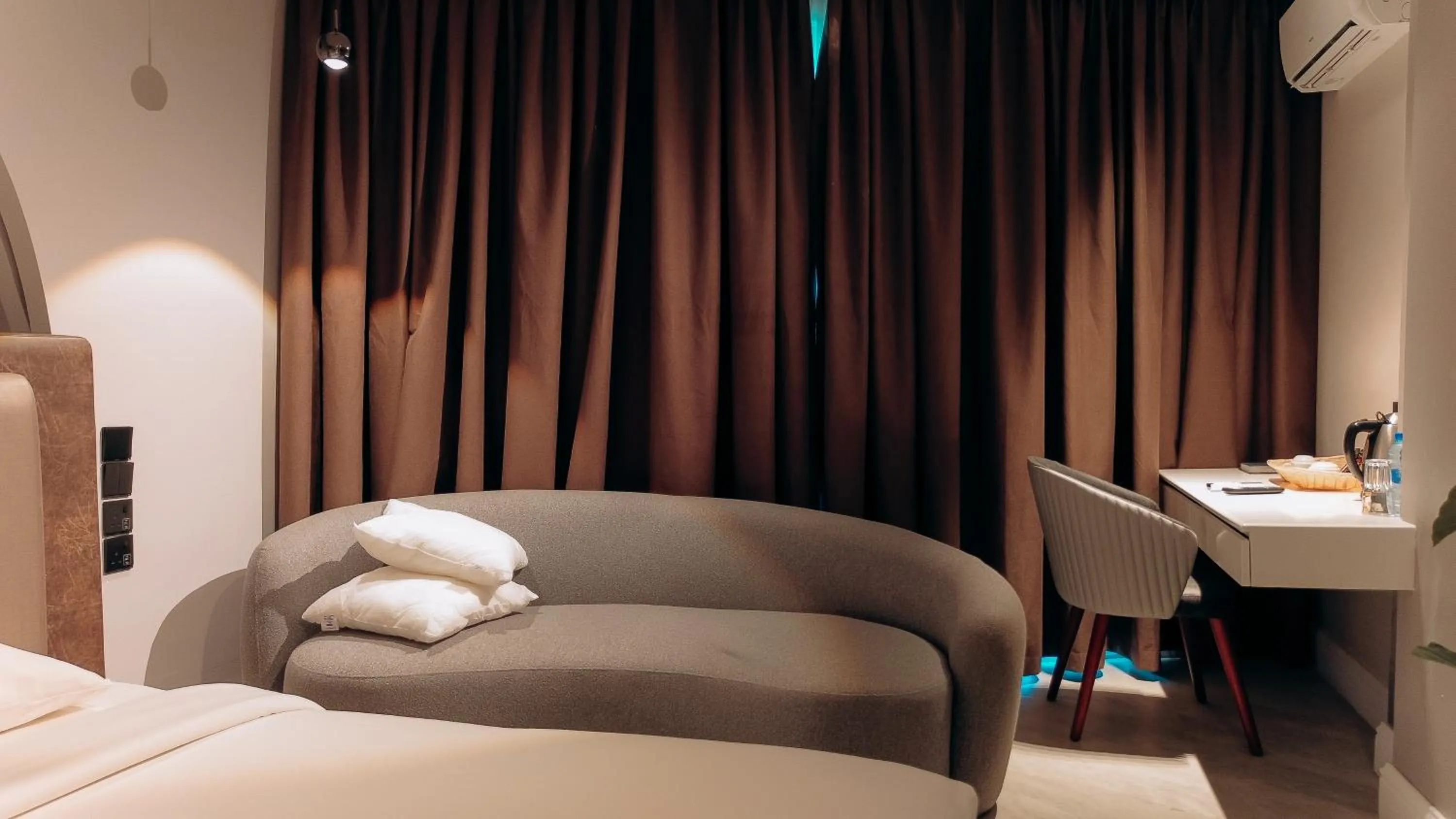 Photo of the whole room, Bed in Tanga Beach Resort & Spa