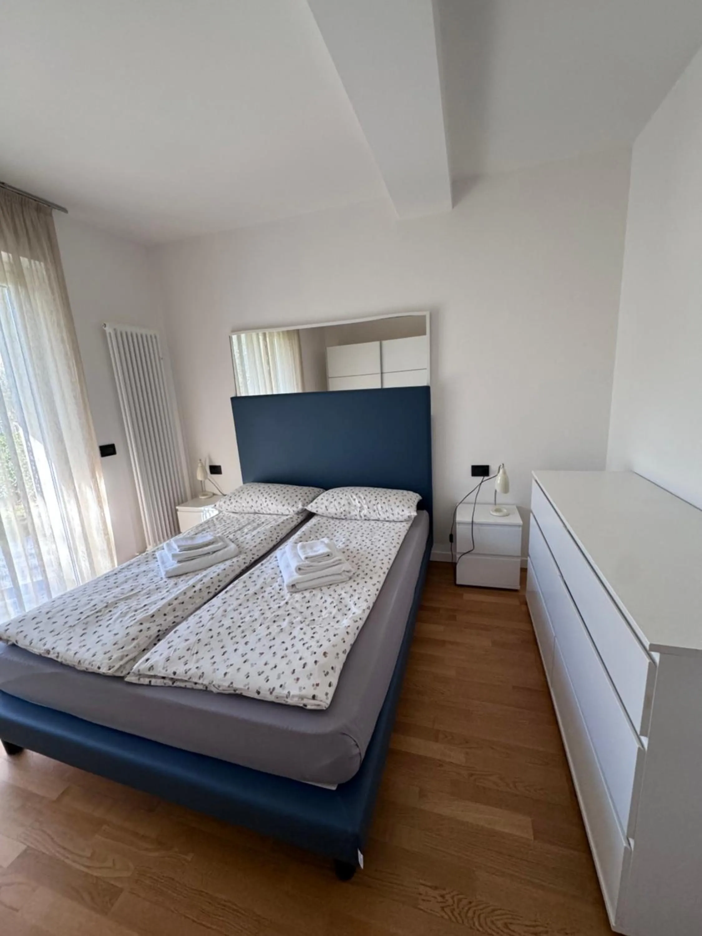 Bed in GARDA LIVING APARTMENTS Riva del Garda
