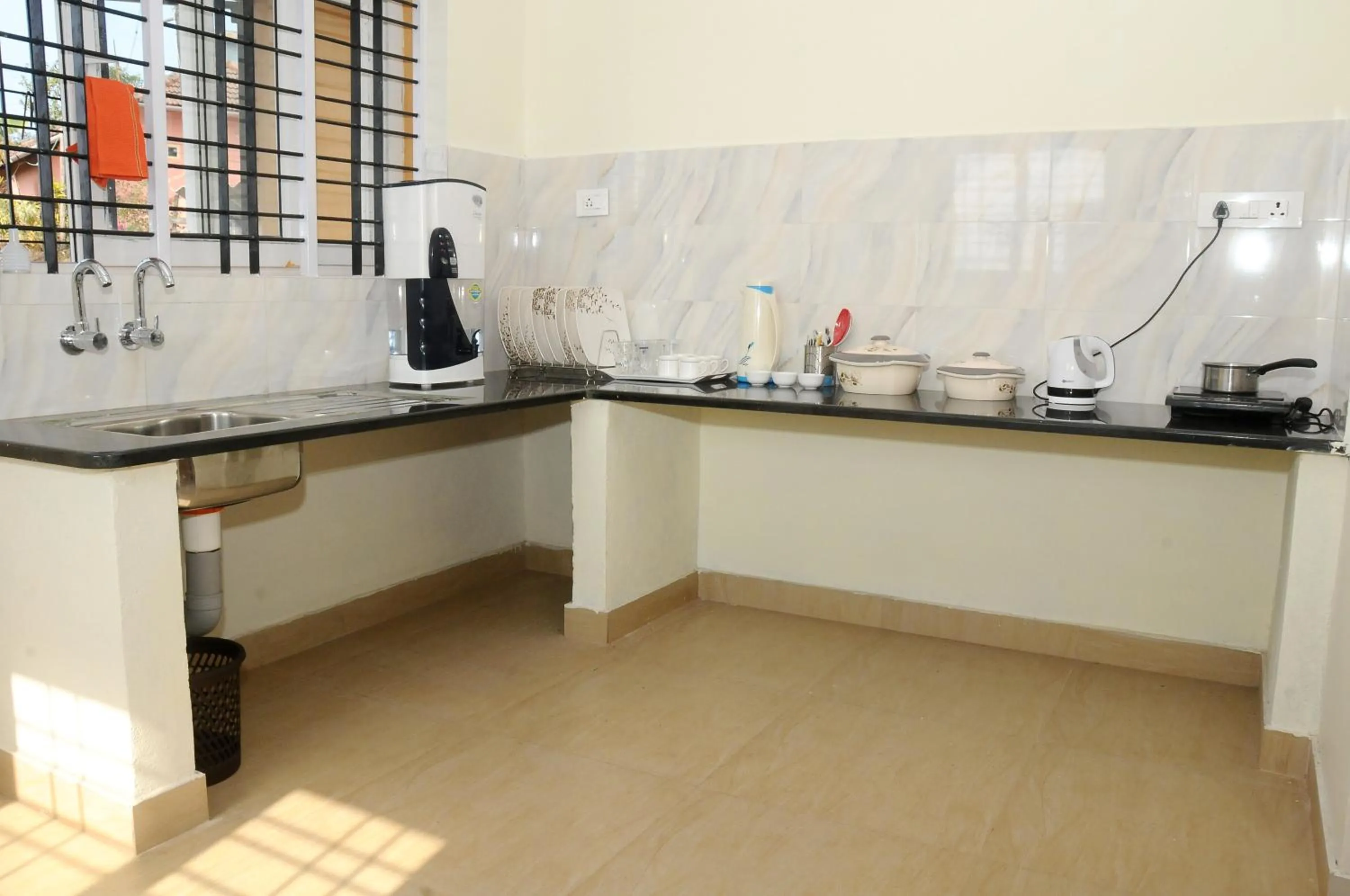 Kitchen or kitchenette in Holidayincoorg Orchid Villa