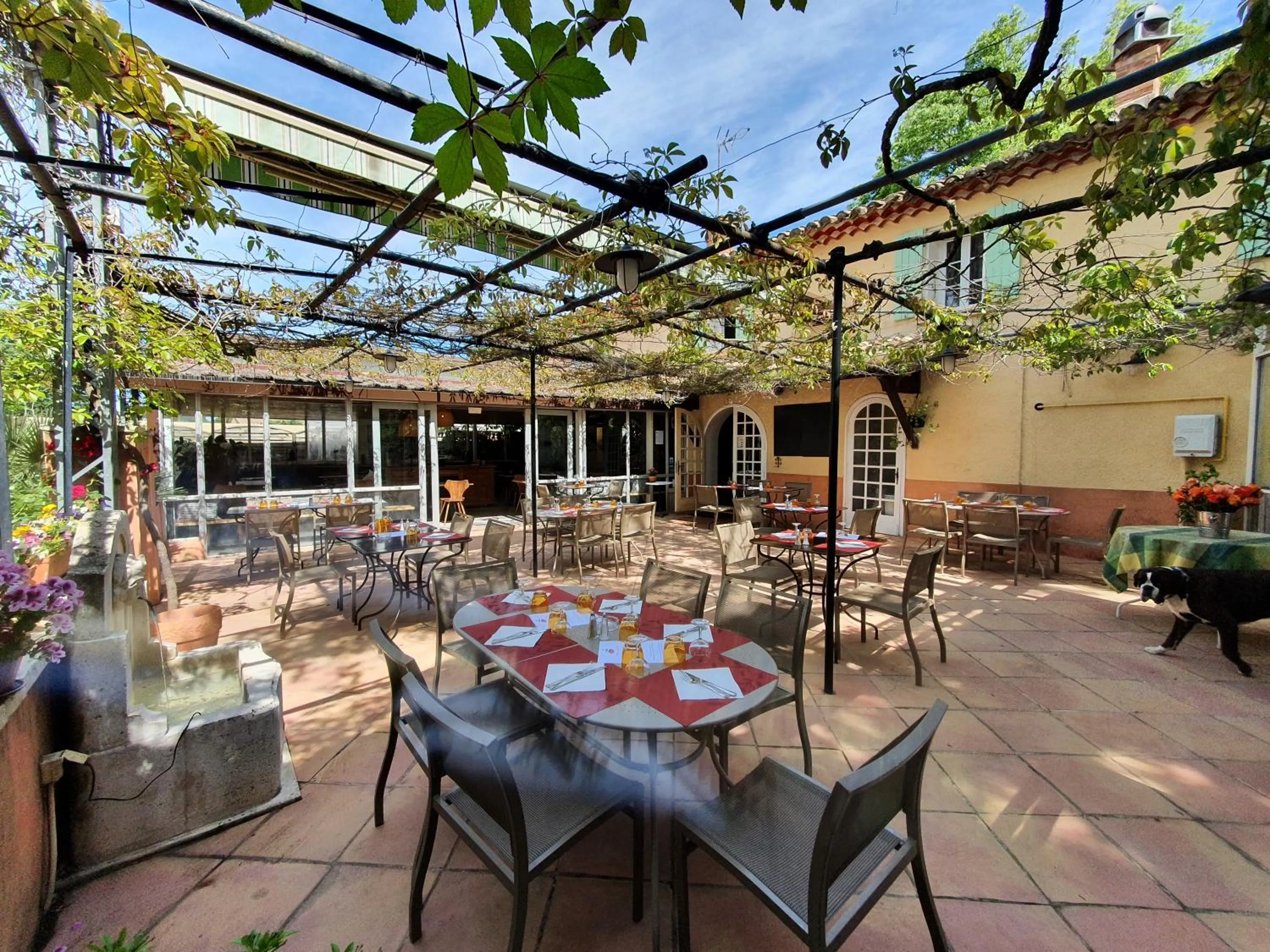 Patio in Logis Hotel Le Chêne Vert