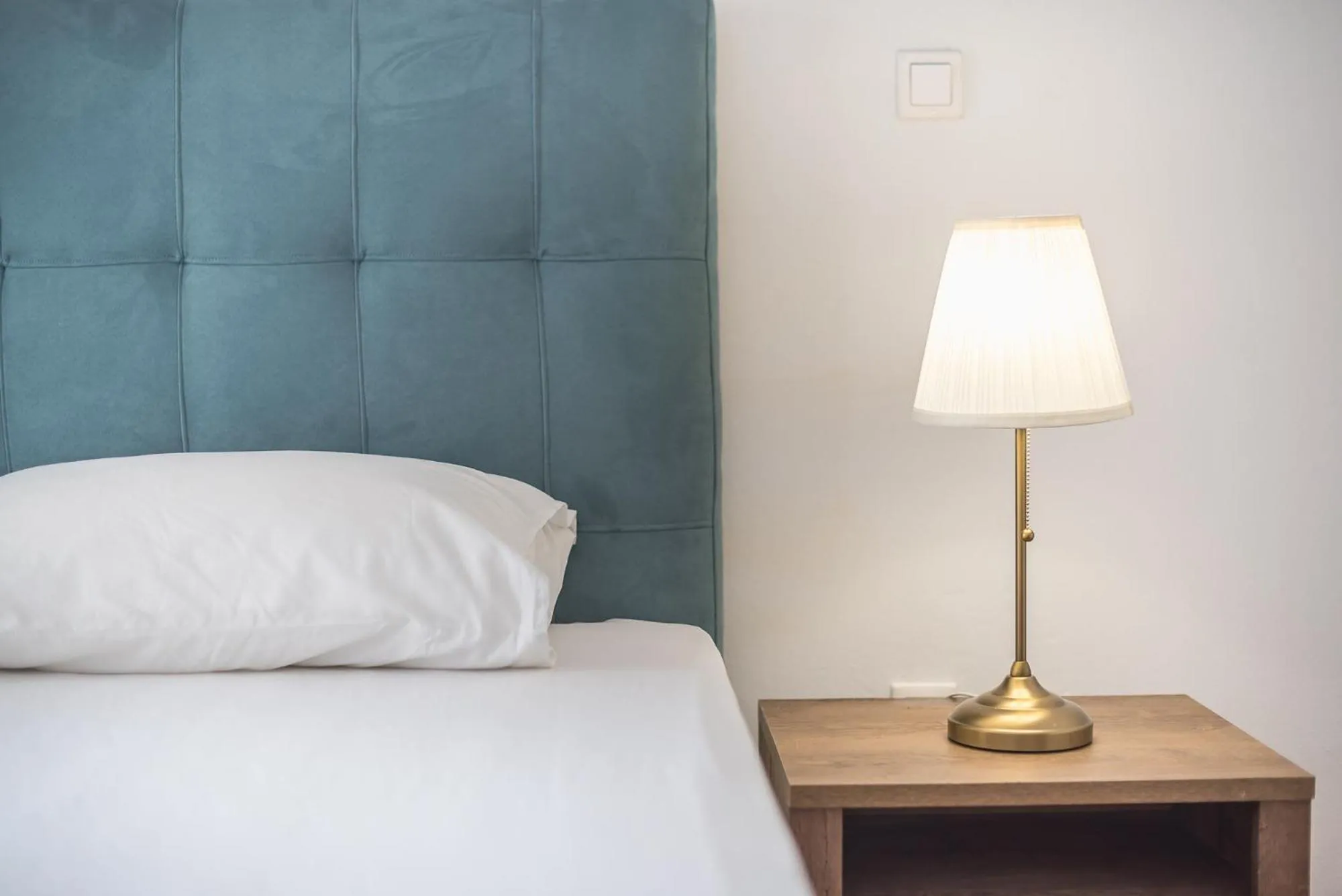 Bed in Victoria Secret Apartments