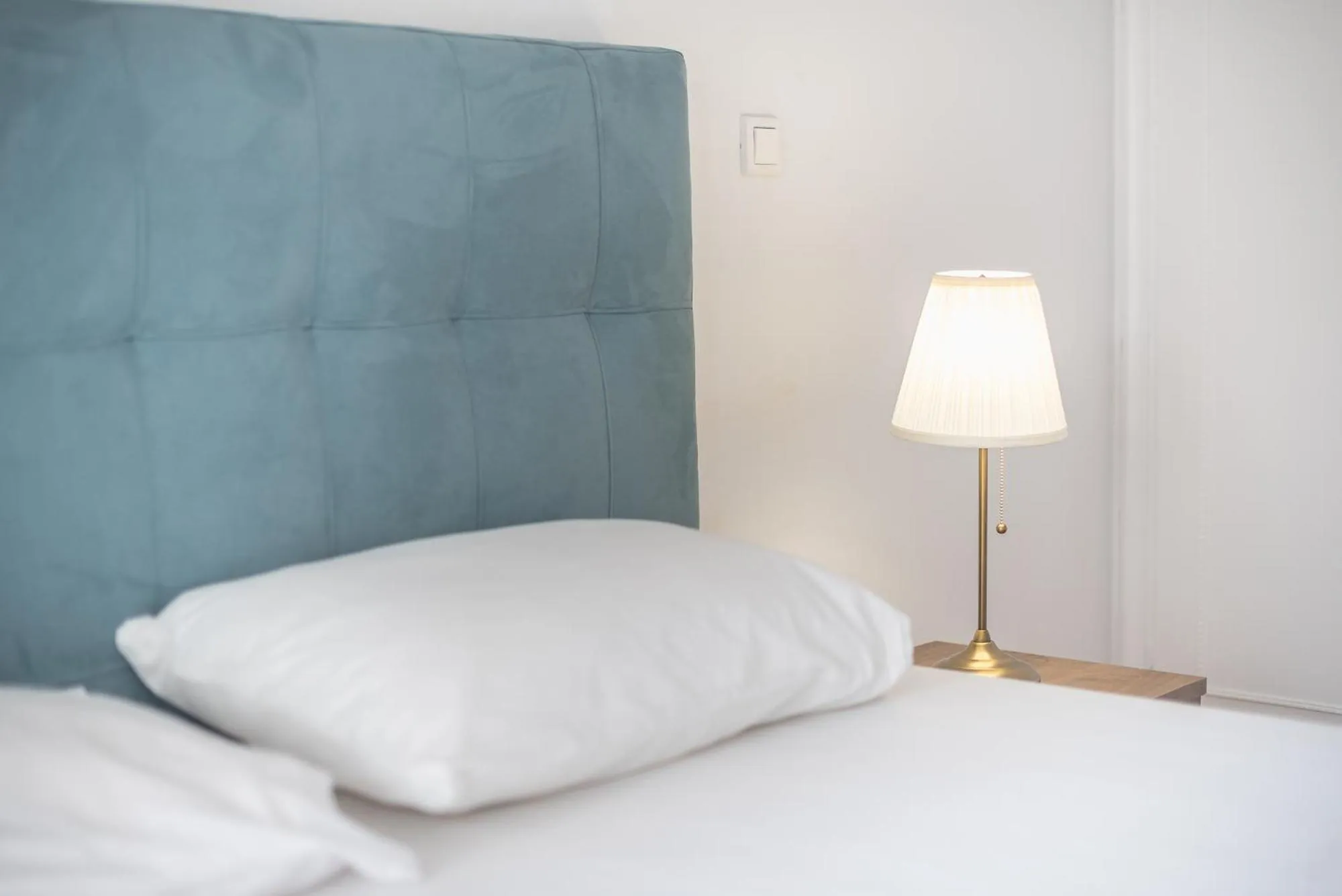 Bed in Victoria Secret Apartments