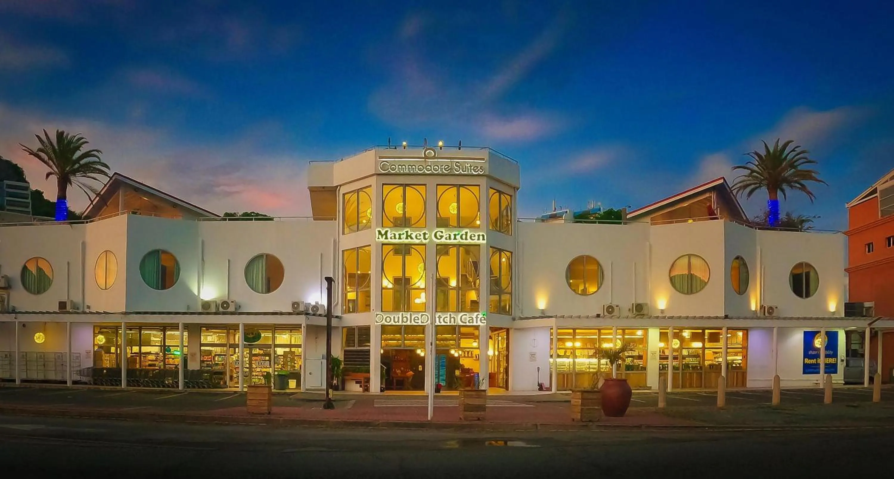 Property building in Commodore Suites, SureStay Collection by Best Western