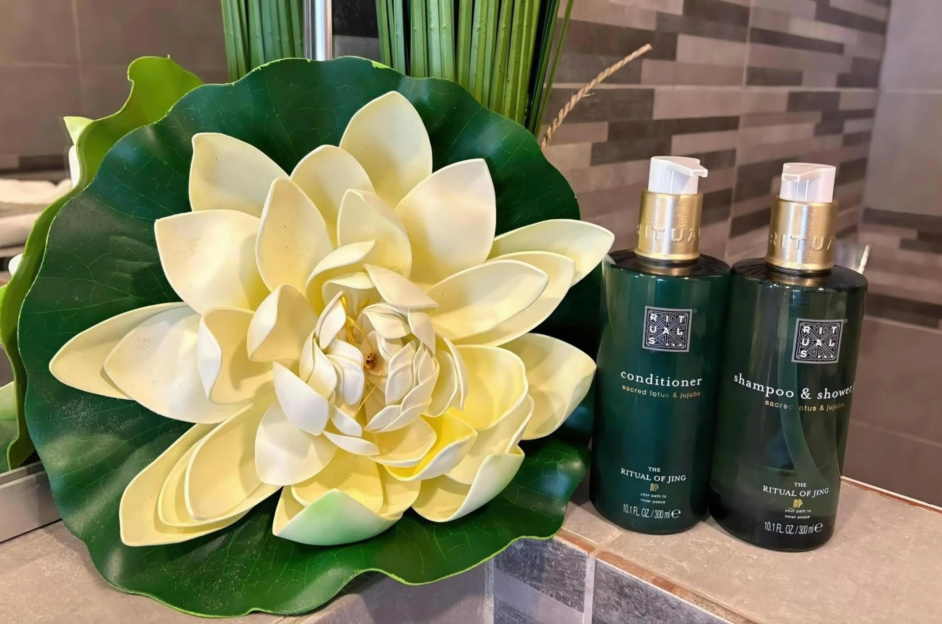 Bathroom in Commodore Suites, SureStay Collection by Best Western