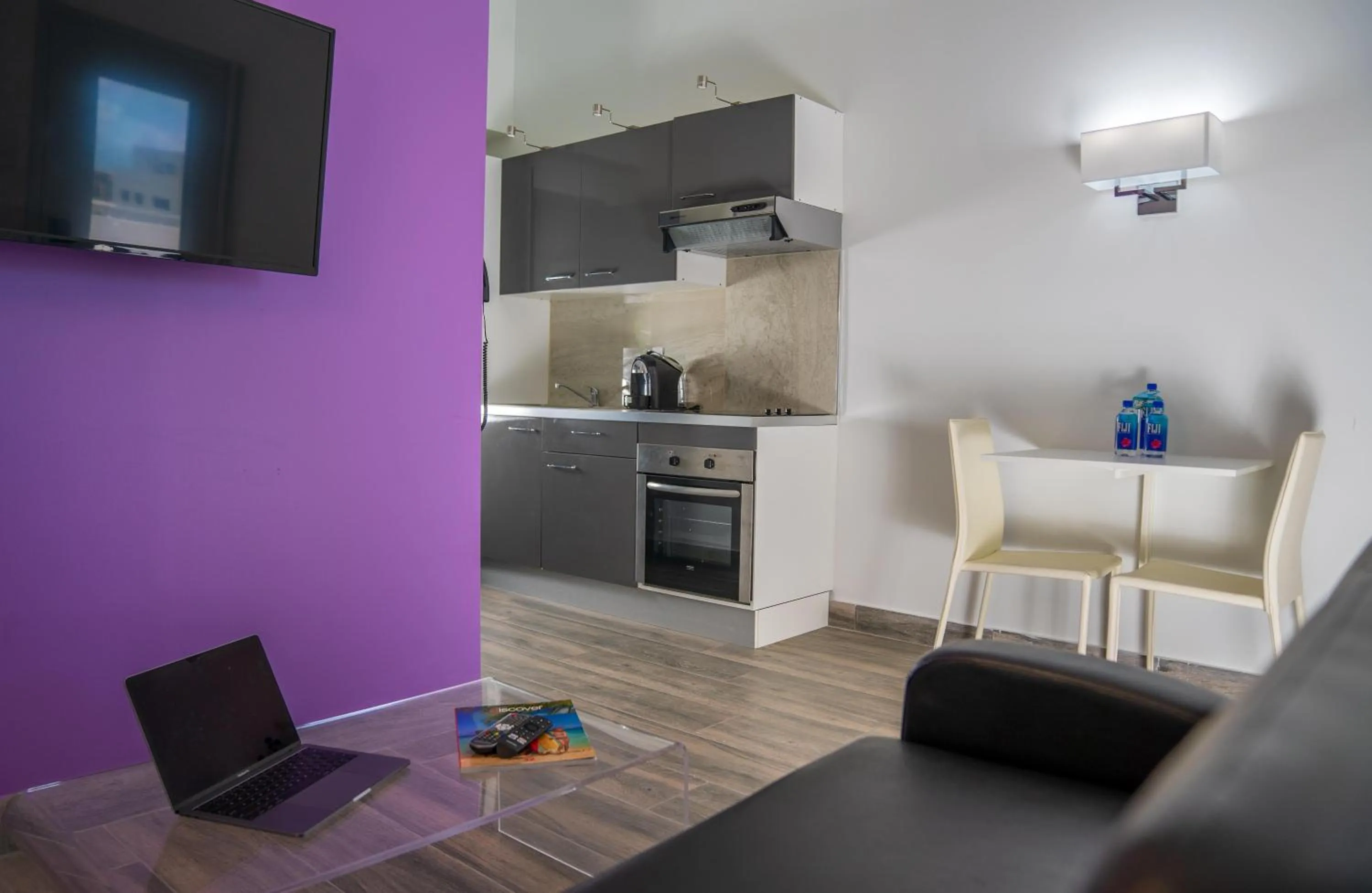 Bedroom in Commodore Suites, SureStay Collection by Best Western