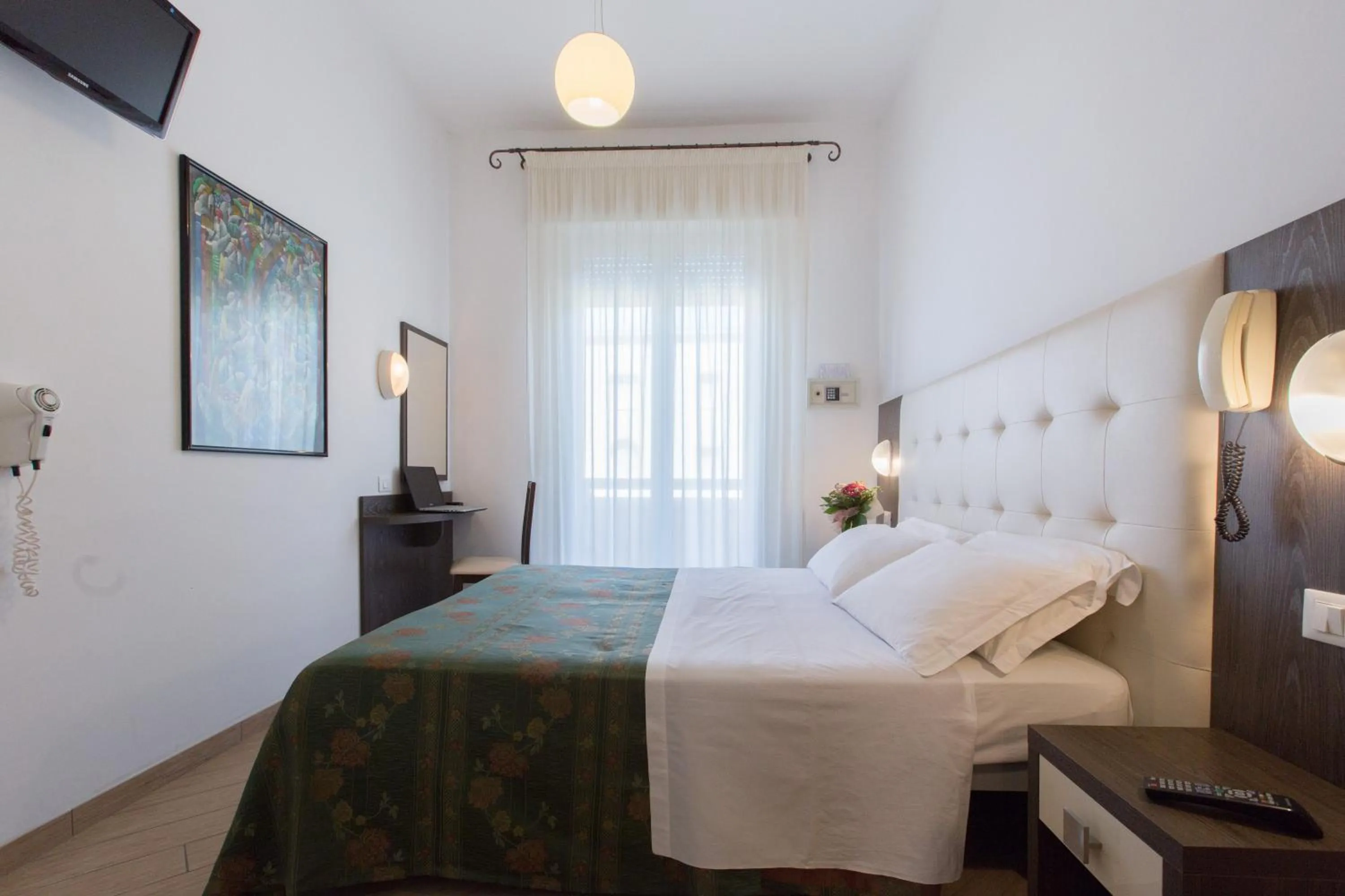 Bedroom in Hotel La Capinera