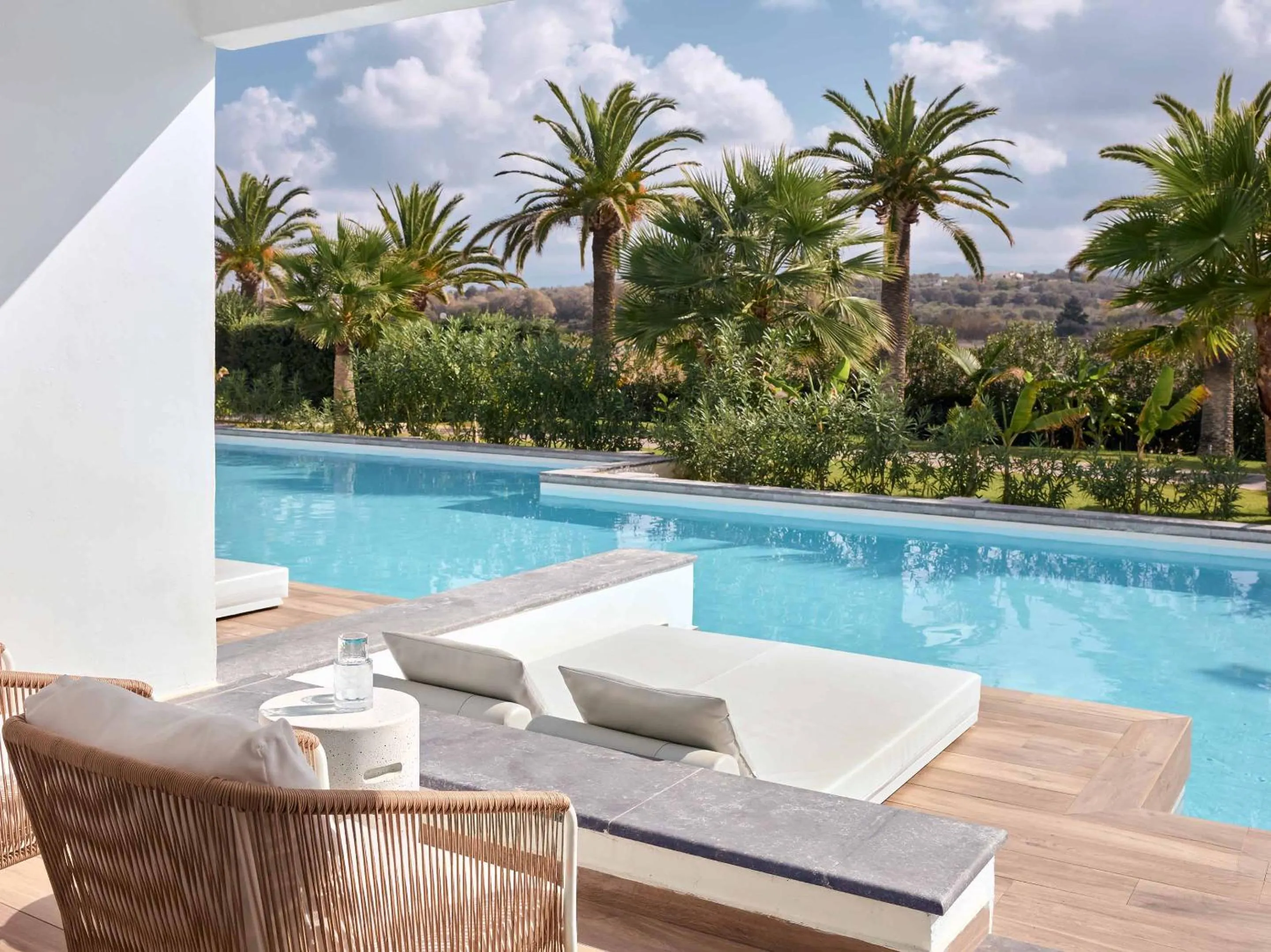 Swimming pool in Grecotel LUXME White