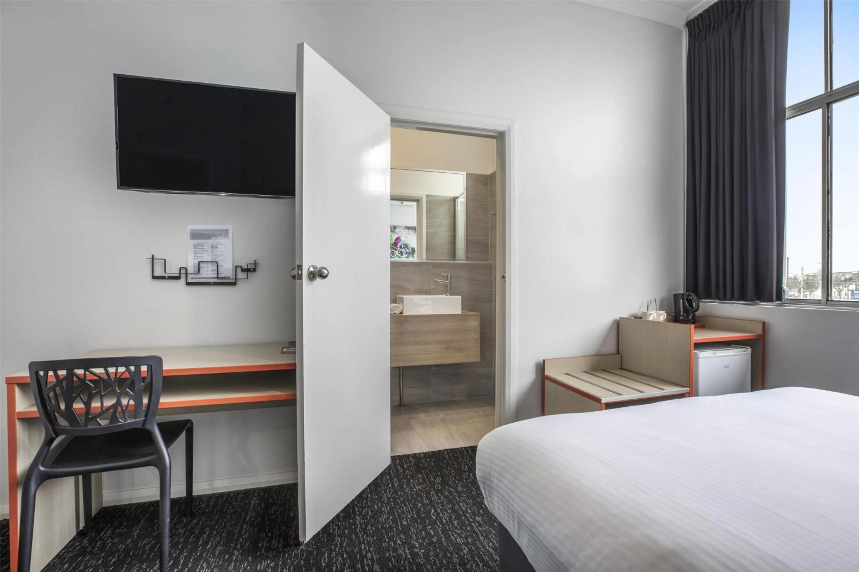 Bedroom, Bed in Nightcap at Ashley Hotel