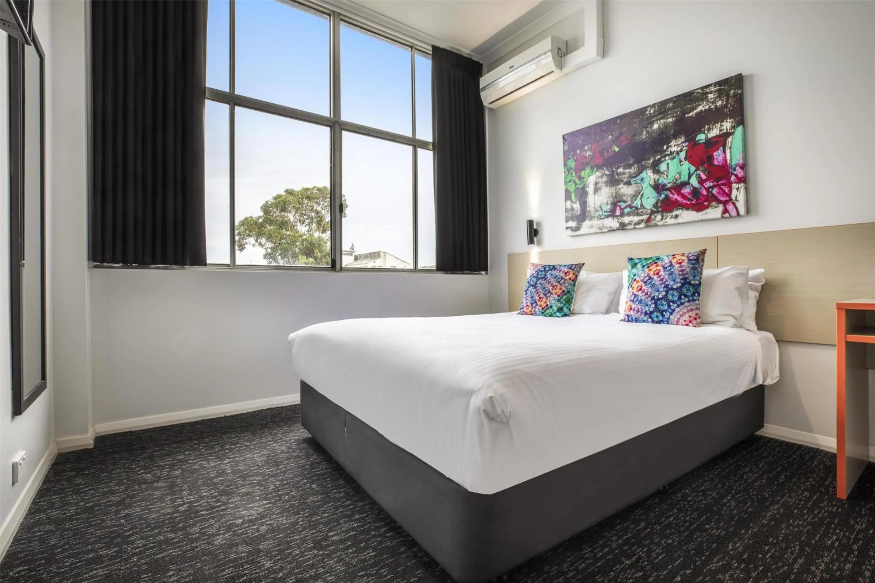 Bedroom, Bed in Nightcap at Ashley Hotel