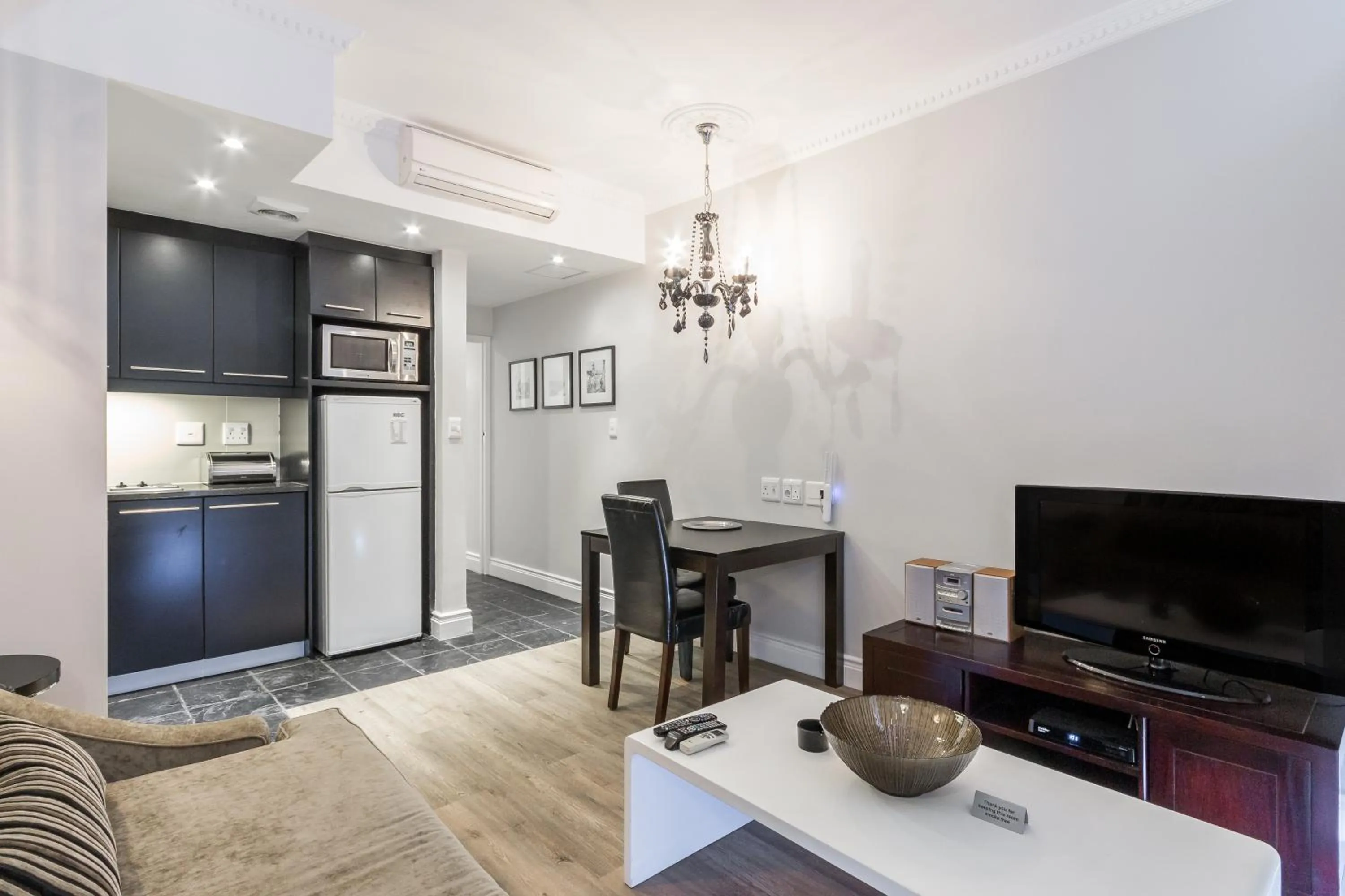 TV and multimedia in Romney Park Luxury Apartments by The Stay Collection