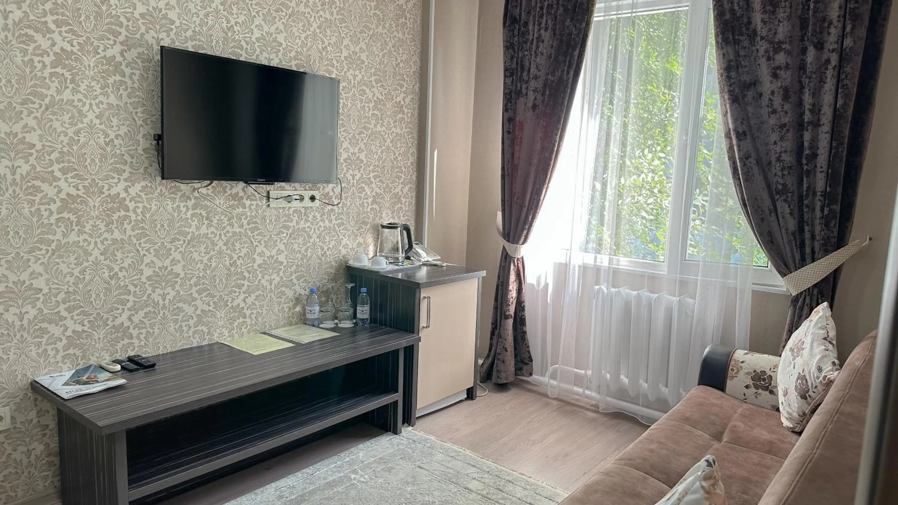 Seating area, Bed in Resident Hotel Almaty