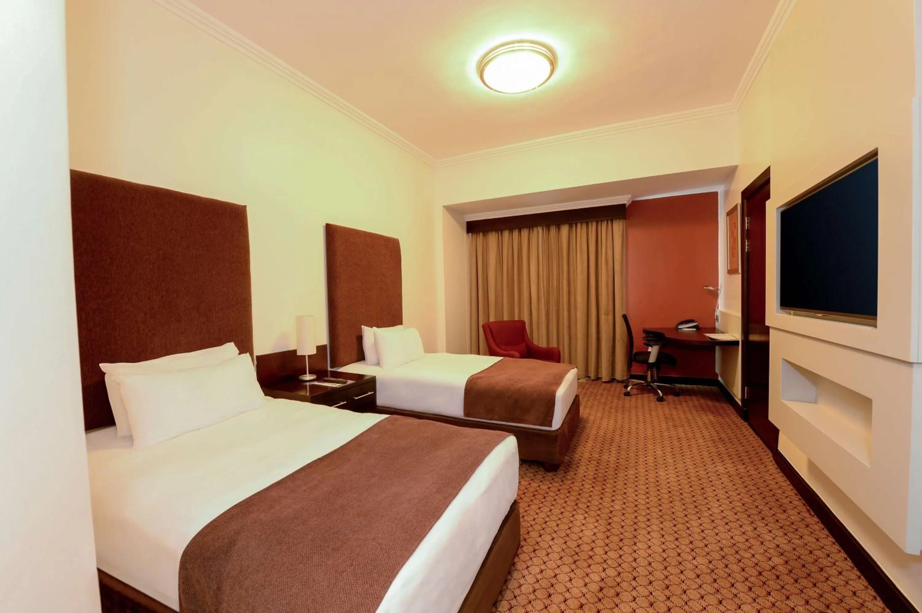 Bedroom, Bed in Holiday Inn Sandton, an IHG Hotel