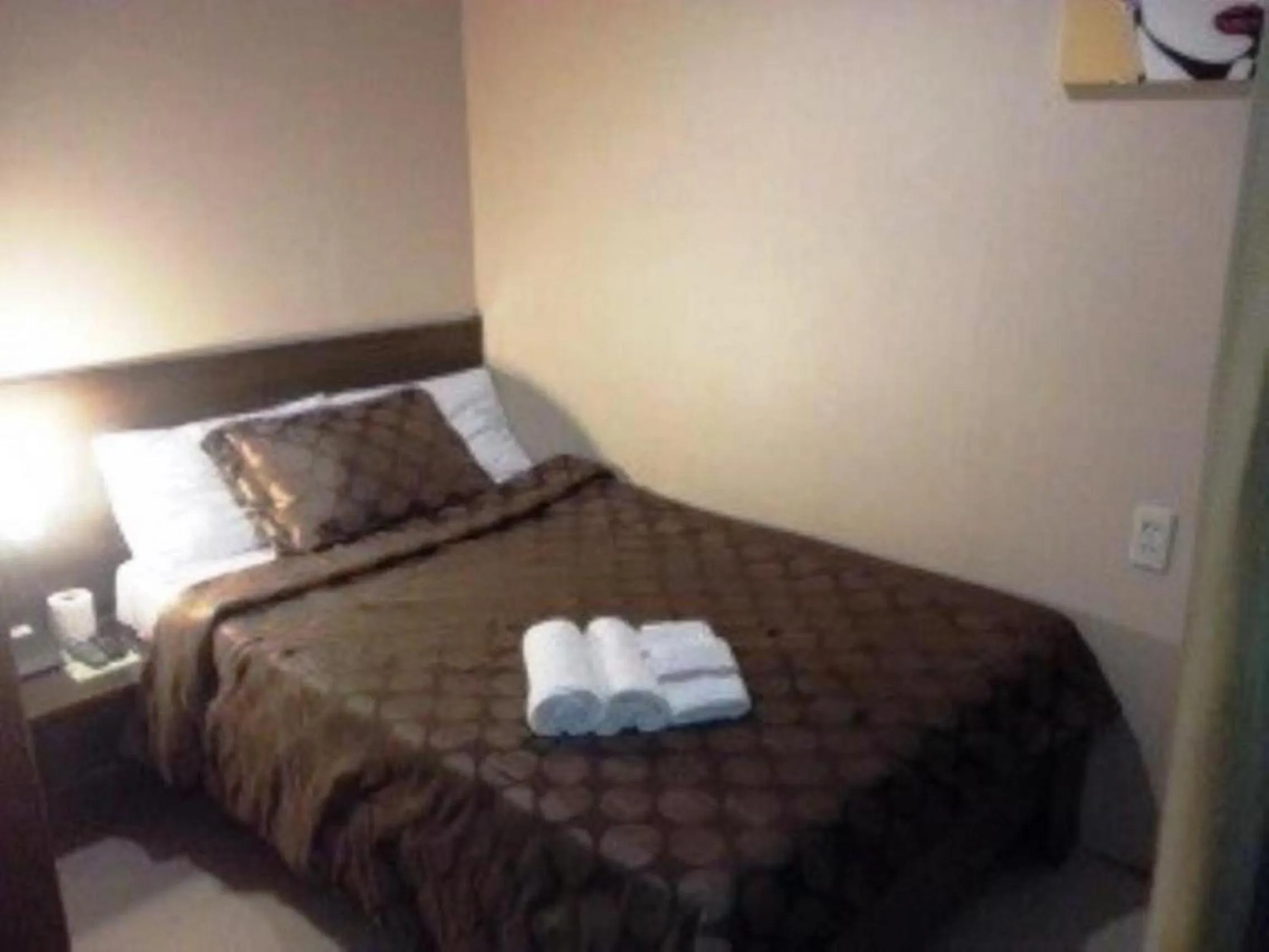 Bed in Hidden Pearl Hotel (Janus Luxury Suites)