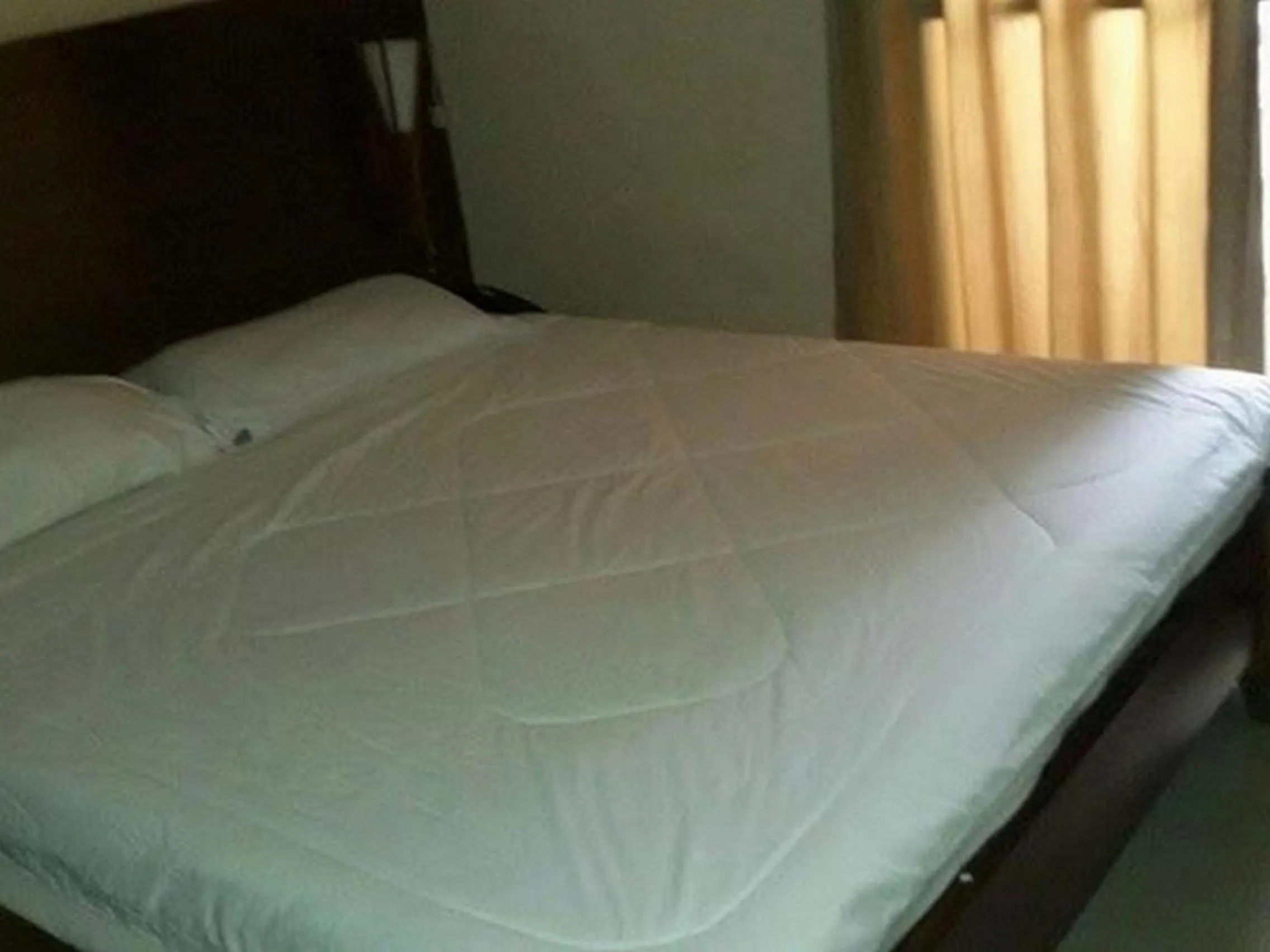 Bed in Hidden Pearl Hotel (Janus Luxury Suites)