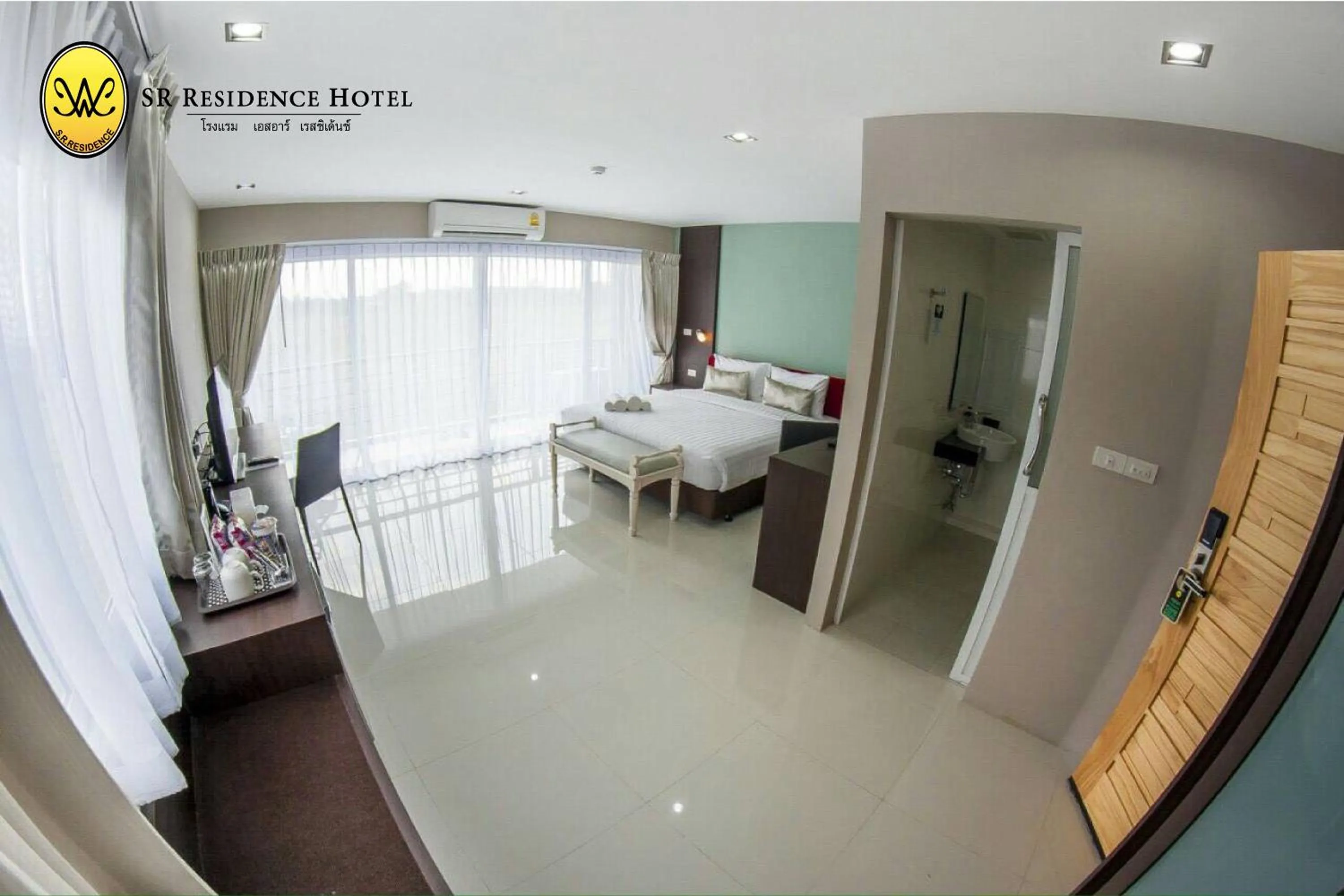 Living room, Bed in SR Residence Hotel