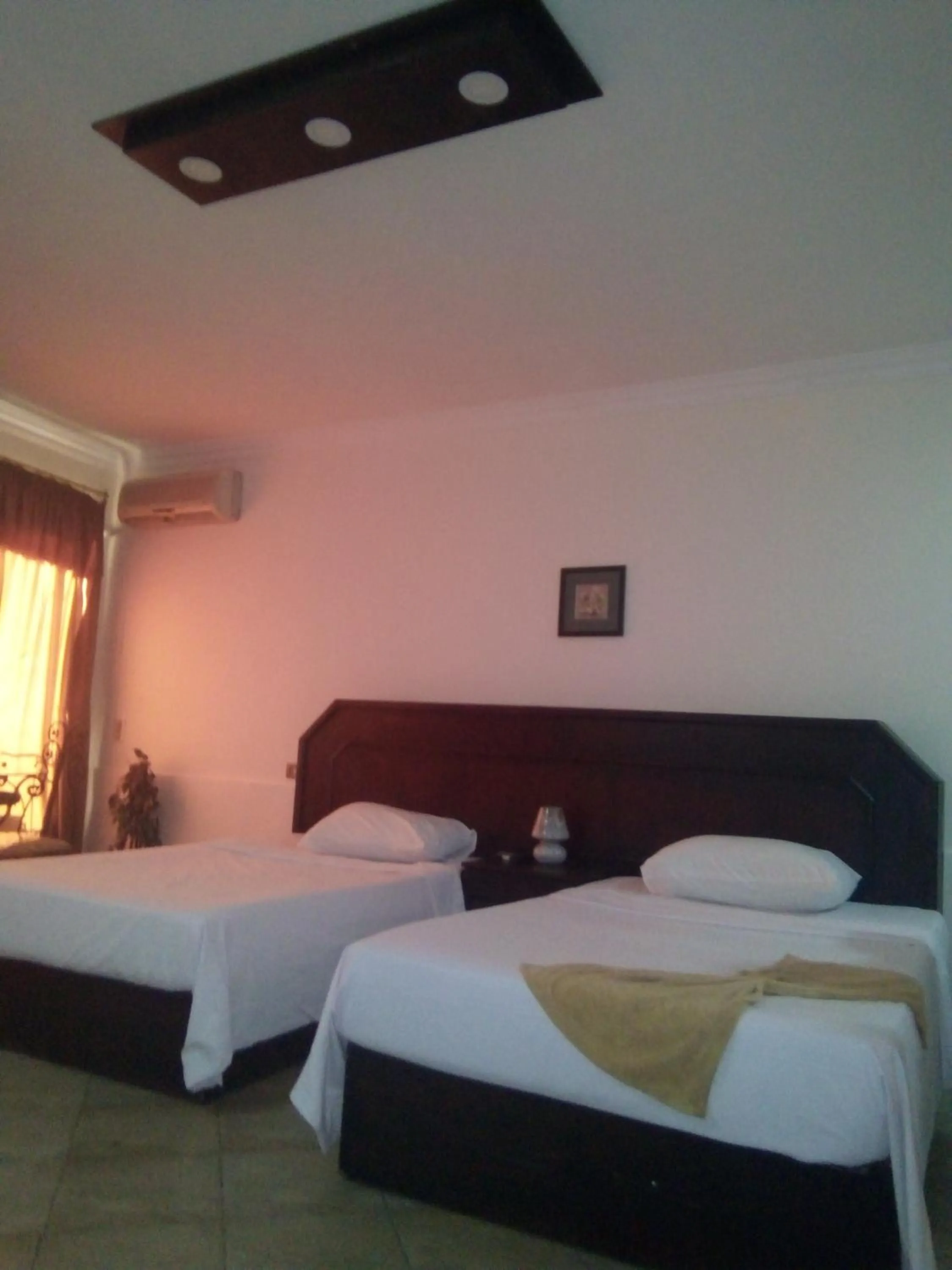 Bed in Arabesque Hotel