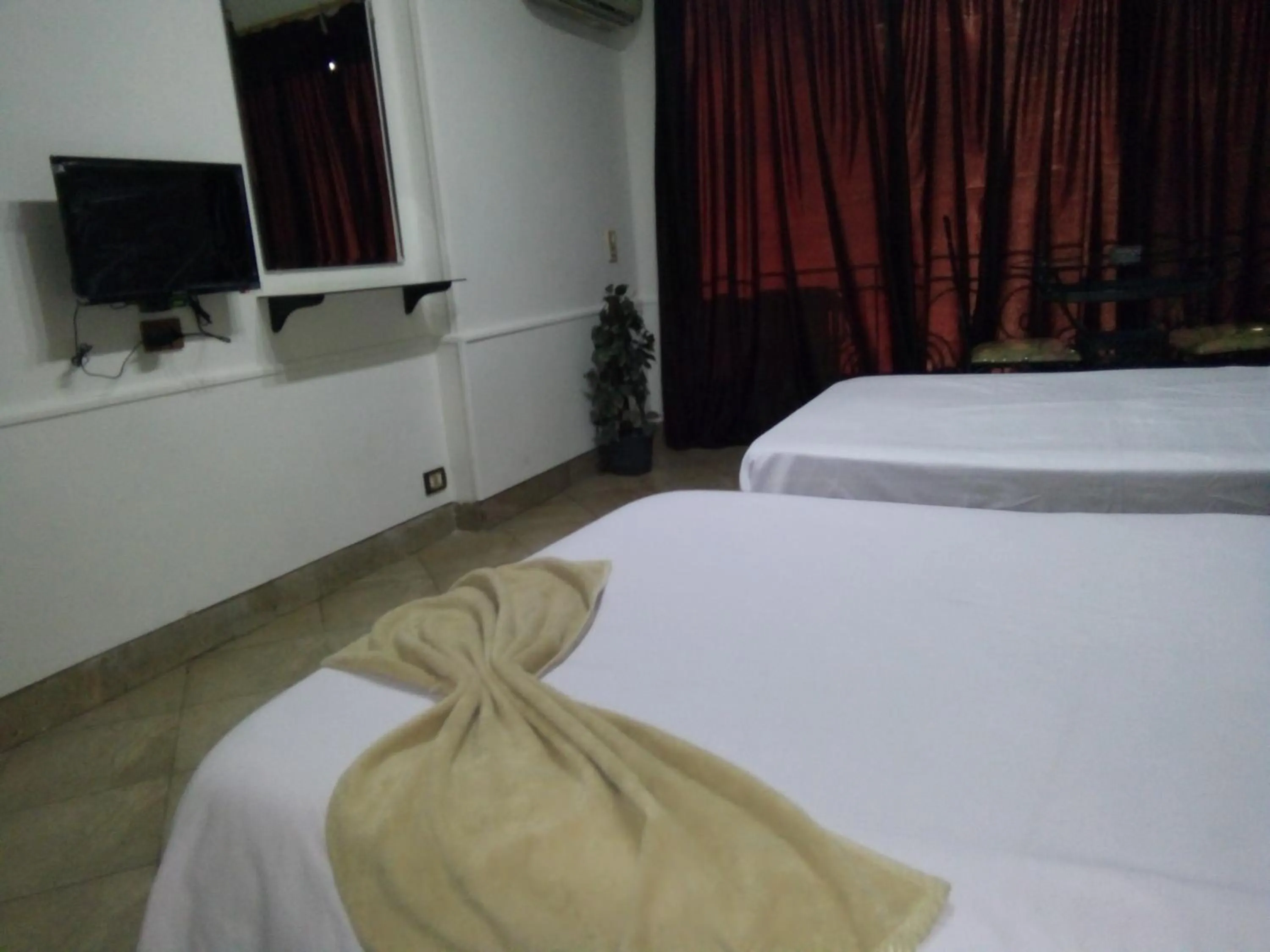 Bed in Arabesque Hotel