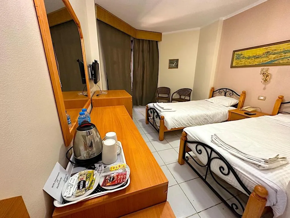 Bed in Gaddis Hotel, Suites and Apartments