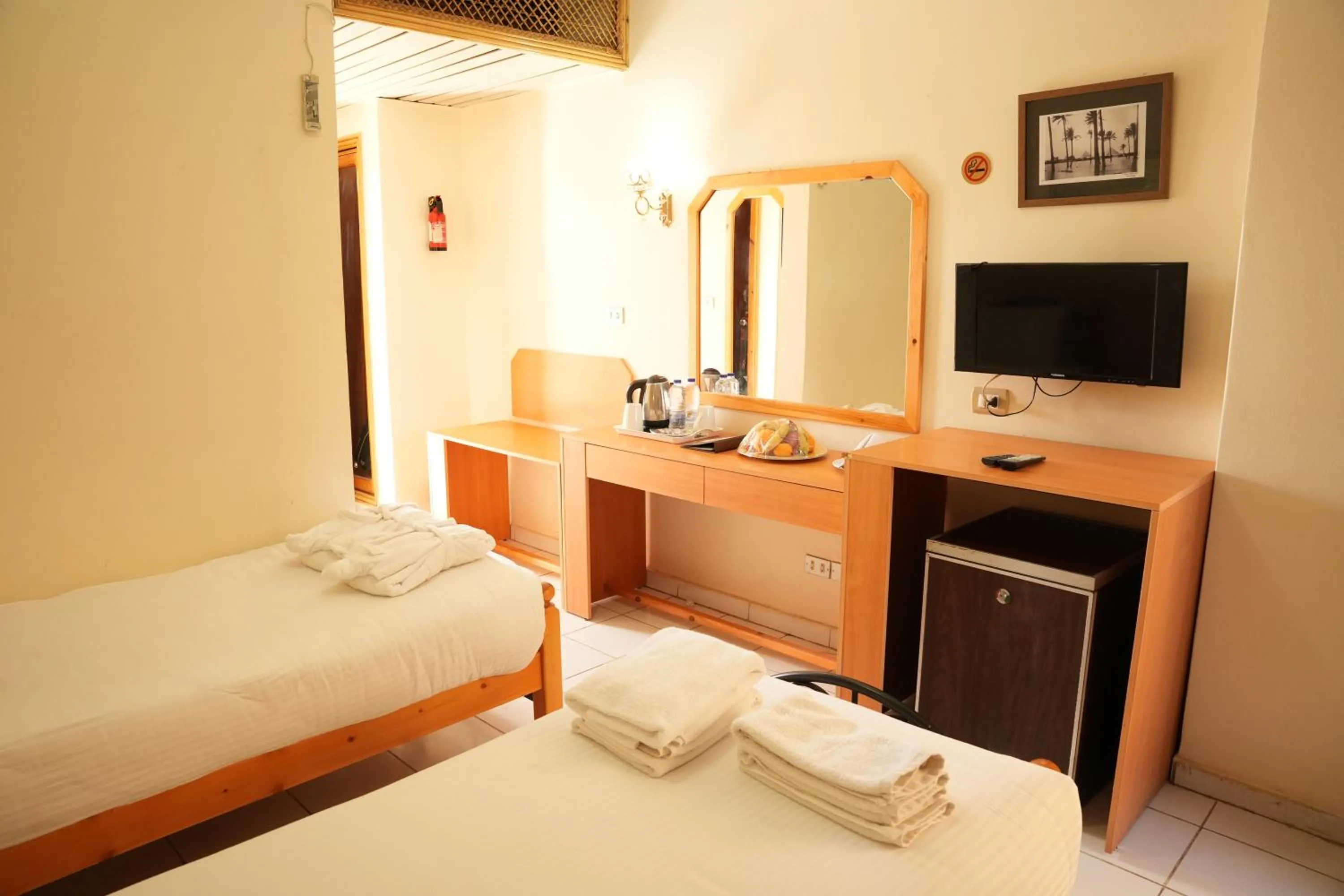 Bed in Gaddis Hotel, Suites and Apartments