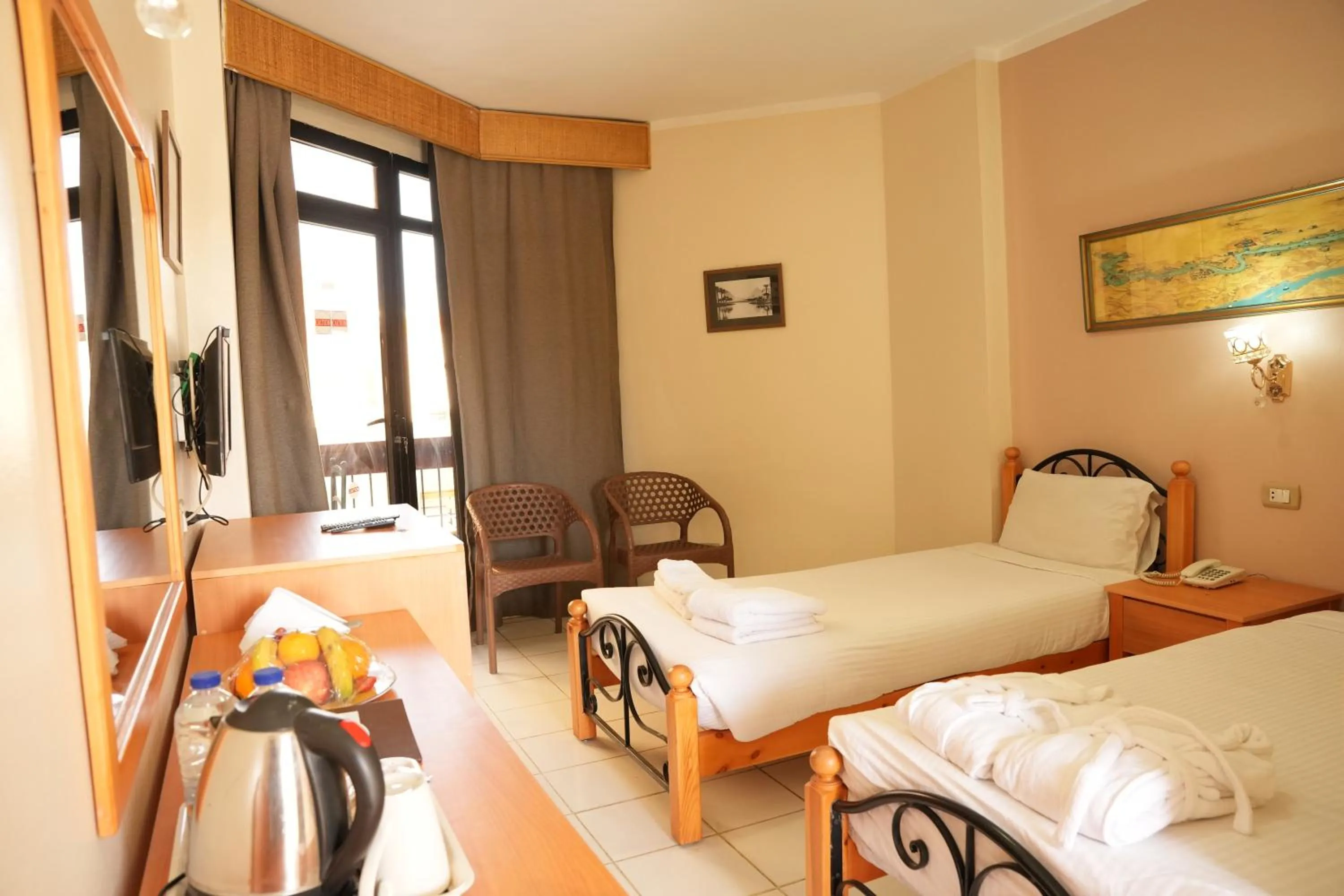 Bed in Gaddis Hotel, Suites and Apartments