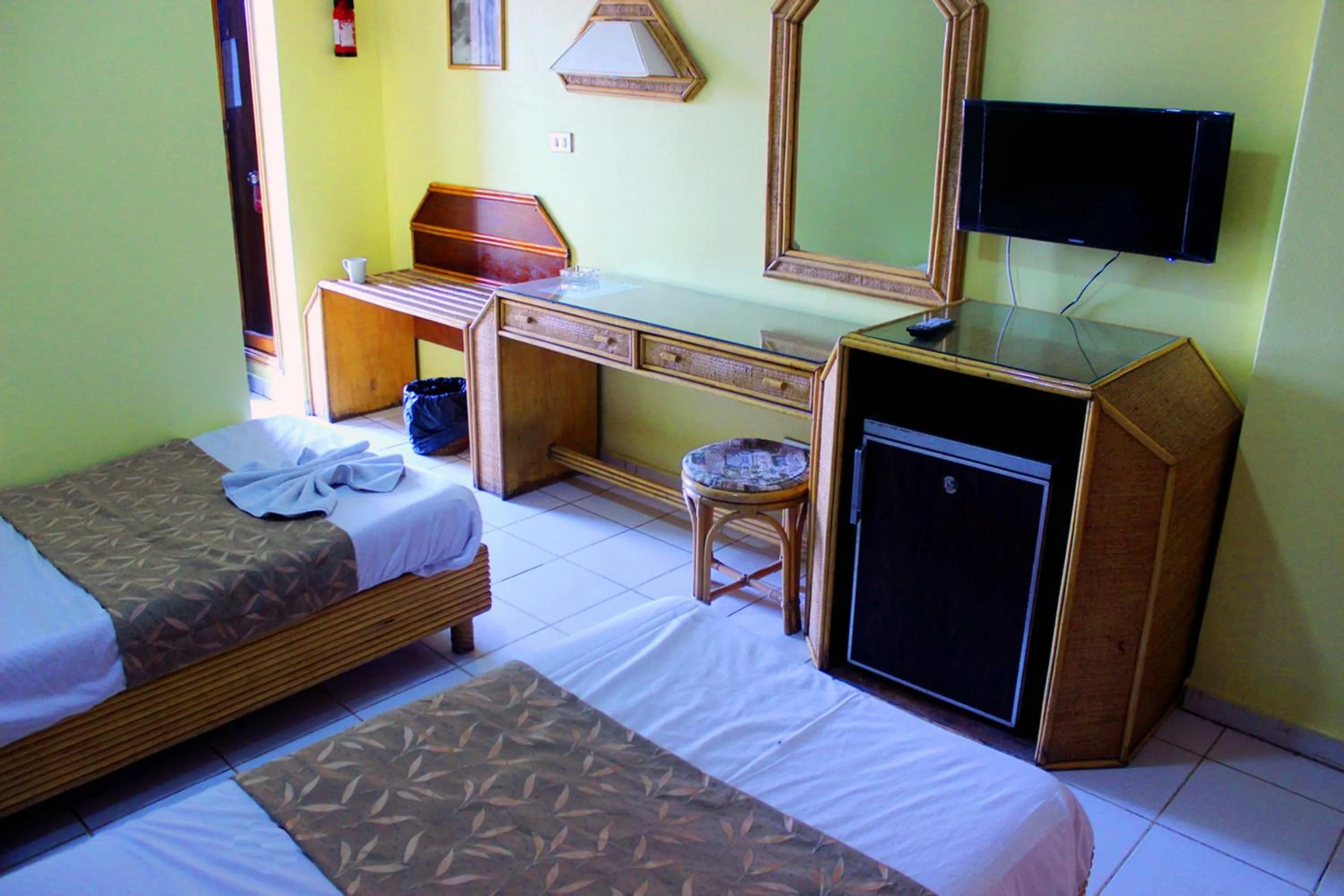 Bed in Gaddis Hotel, Suites and Apartments