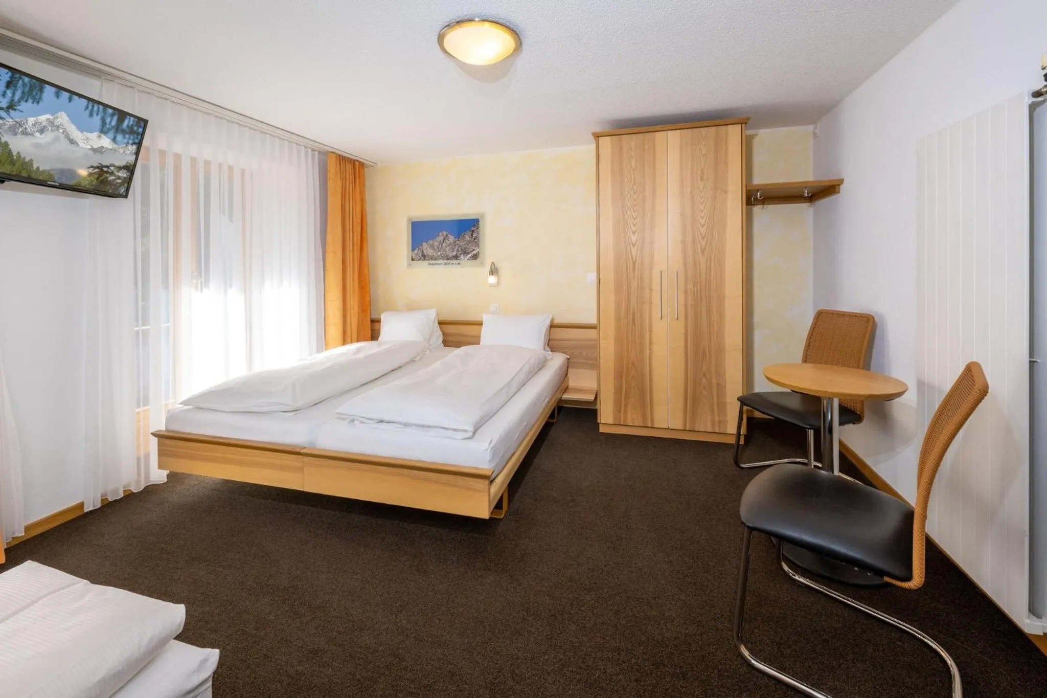 Photo of the whole room, Bed in Aktiv Hotel & Spa Hannigalp