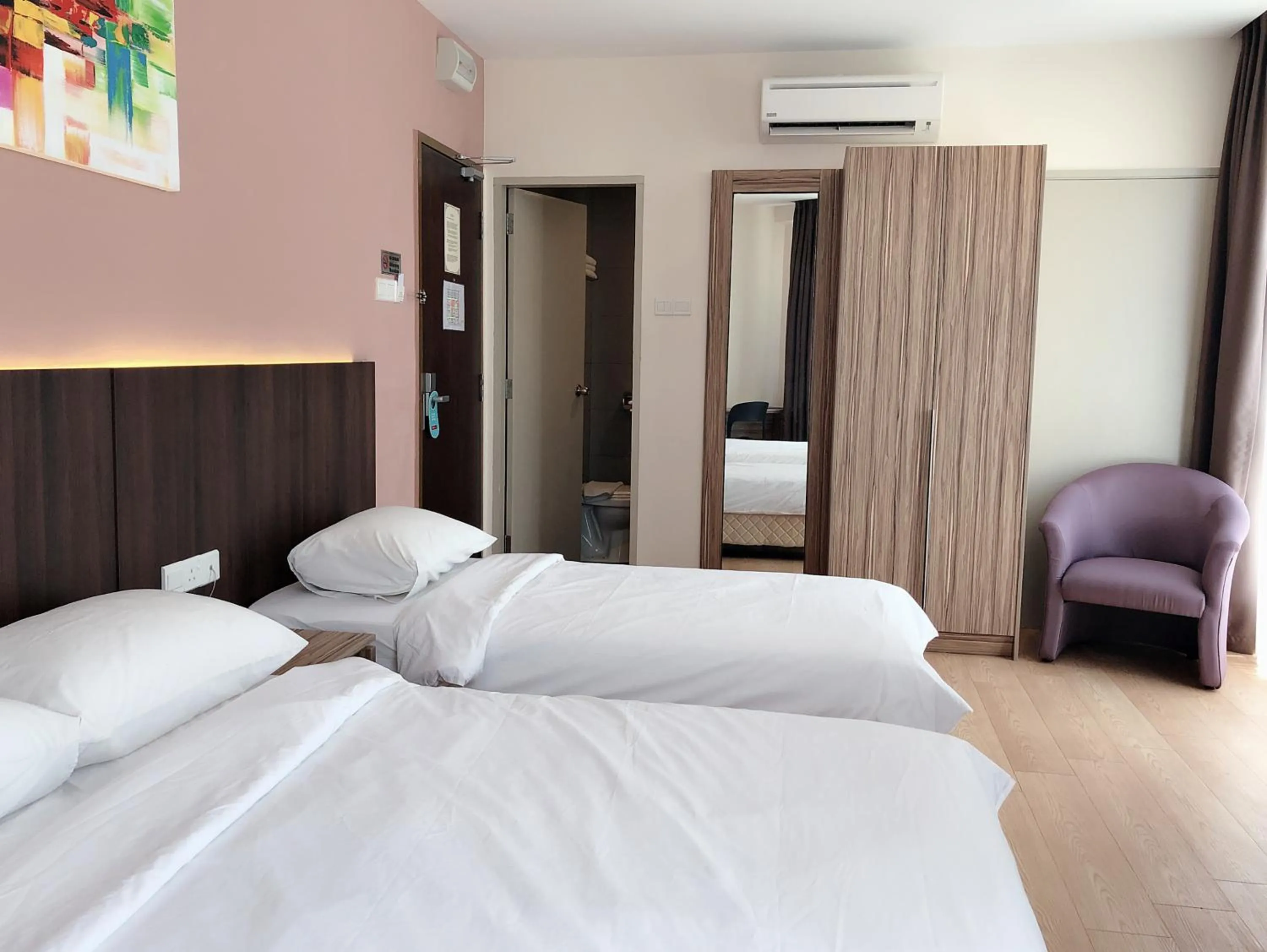 Bed in Tumike Hotel Bentong