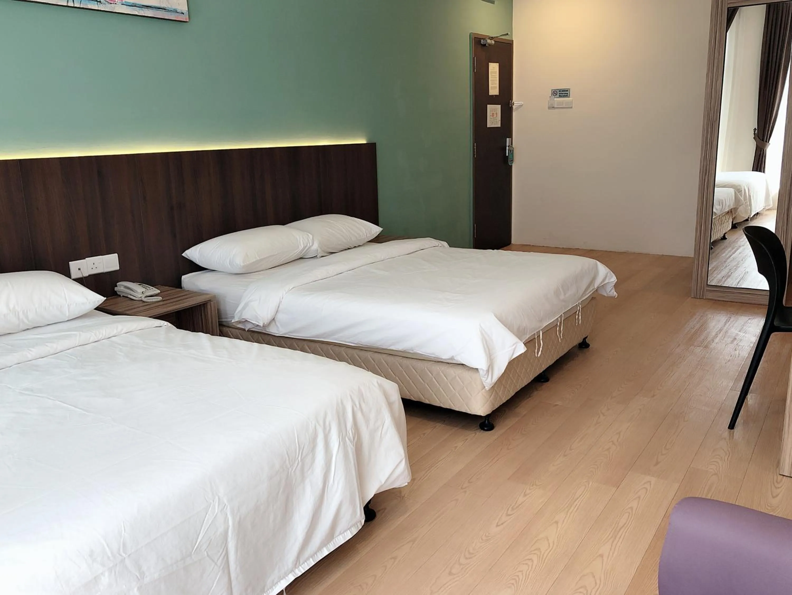 Bed in Tumike Hotel Bentong