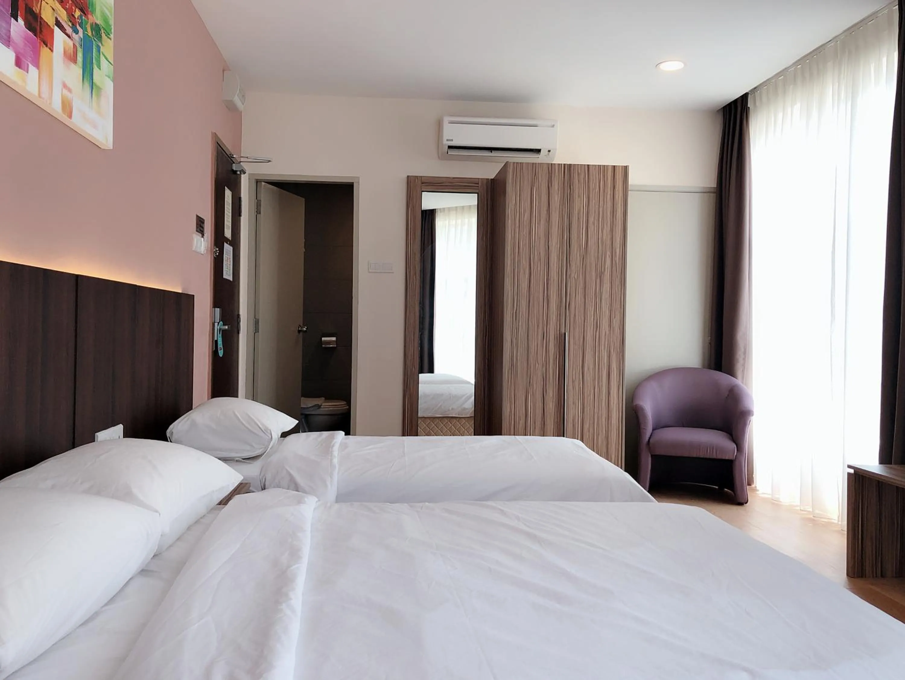 Bed in Tumike Hotel Bentong