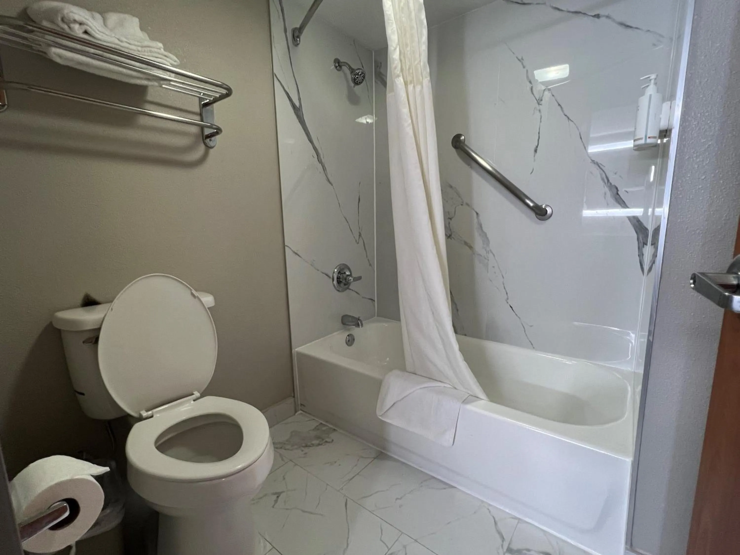 Bathroom in Days Inn by Wyndham Tulsa Central