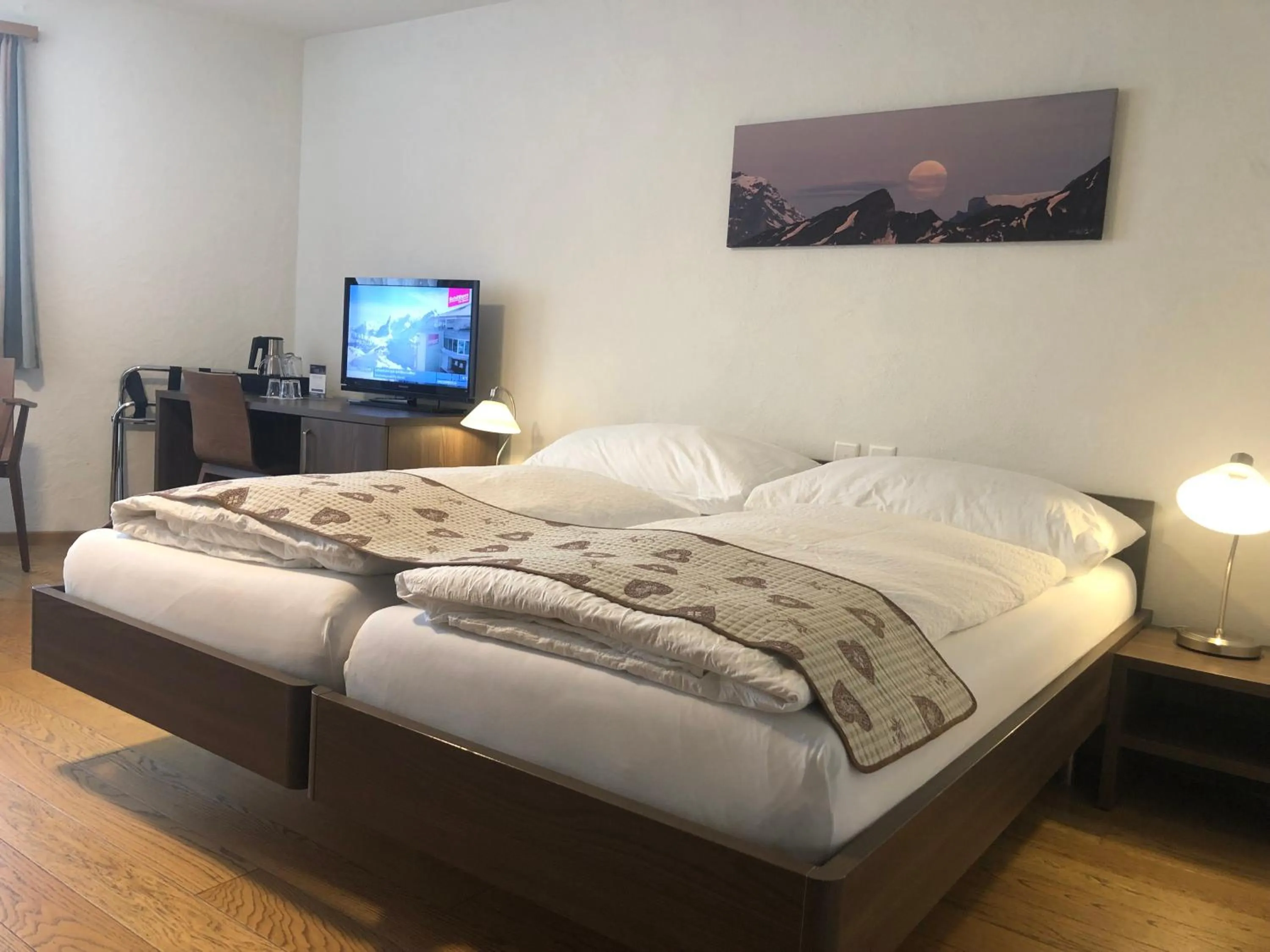 Photo of the whole room, Bed in Hotel Crystal Interlaken