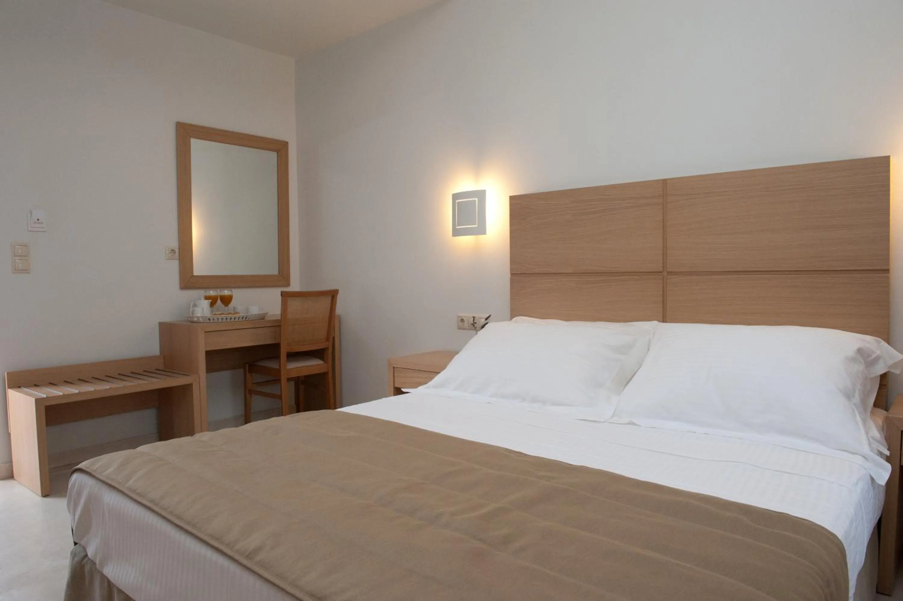 Bed in Aphrodite Samos Suites