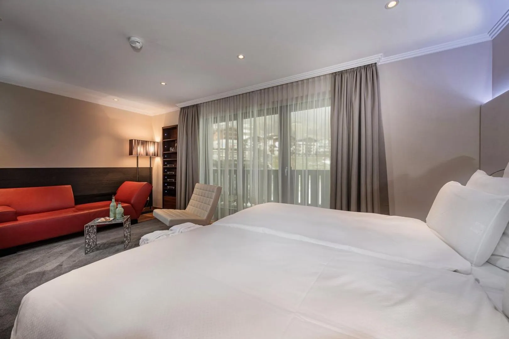 Living room, Bed in Alpinresort ValSaa - Sport & Spa