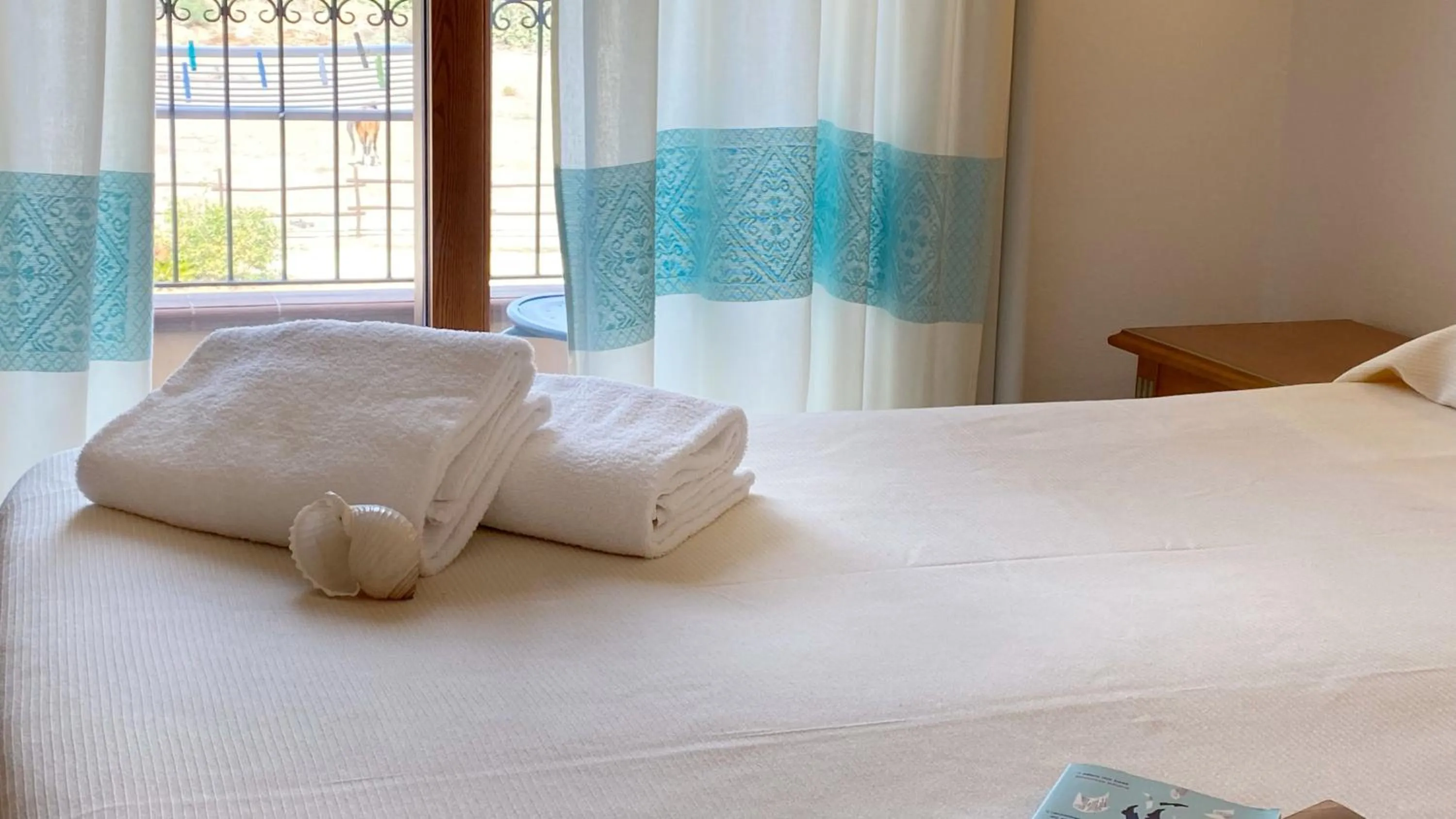 Bed in Le Anfore Hotel