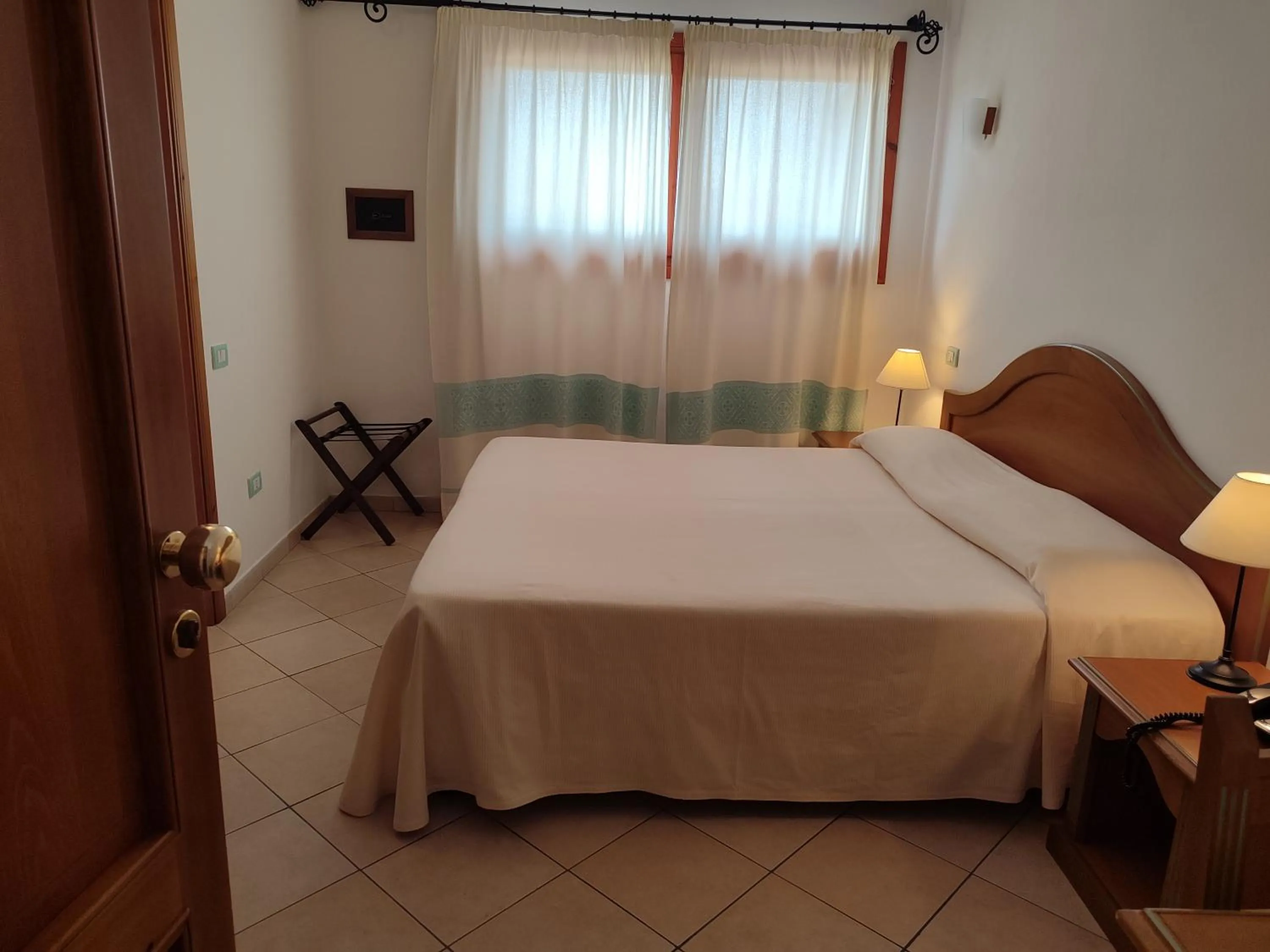 Bed in Le Anfore Hotel