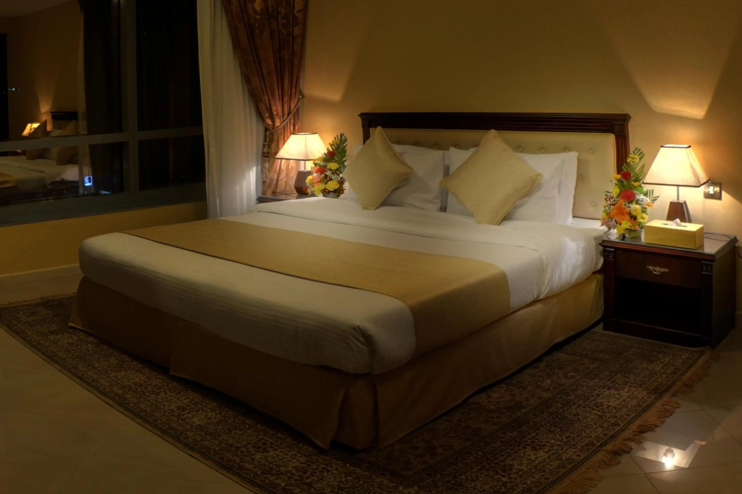 Bed in Deira Suites Deluxe Hotel Suites
