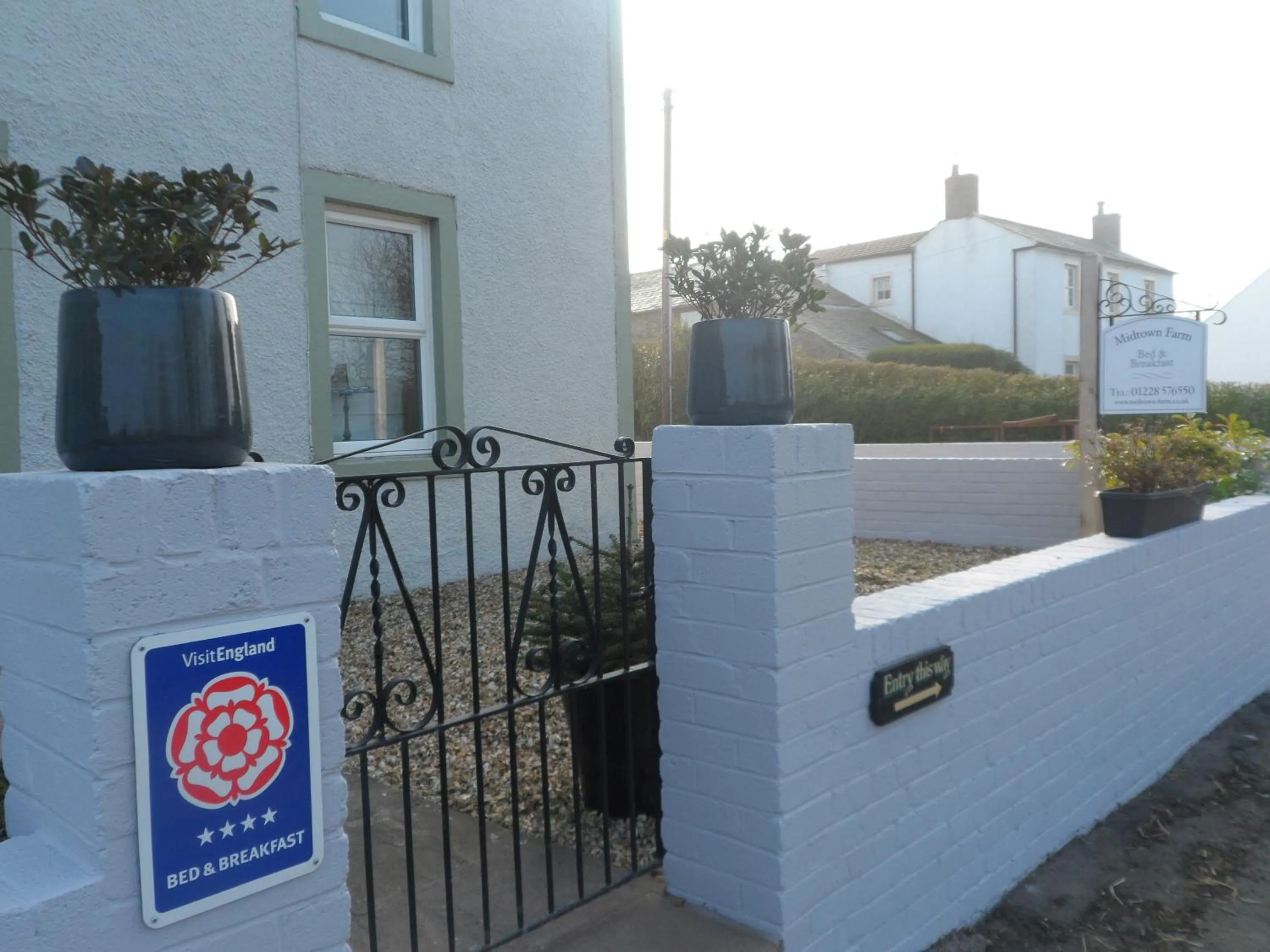 Property logo or sign in Midtown Farm Bed & Breakfast