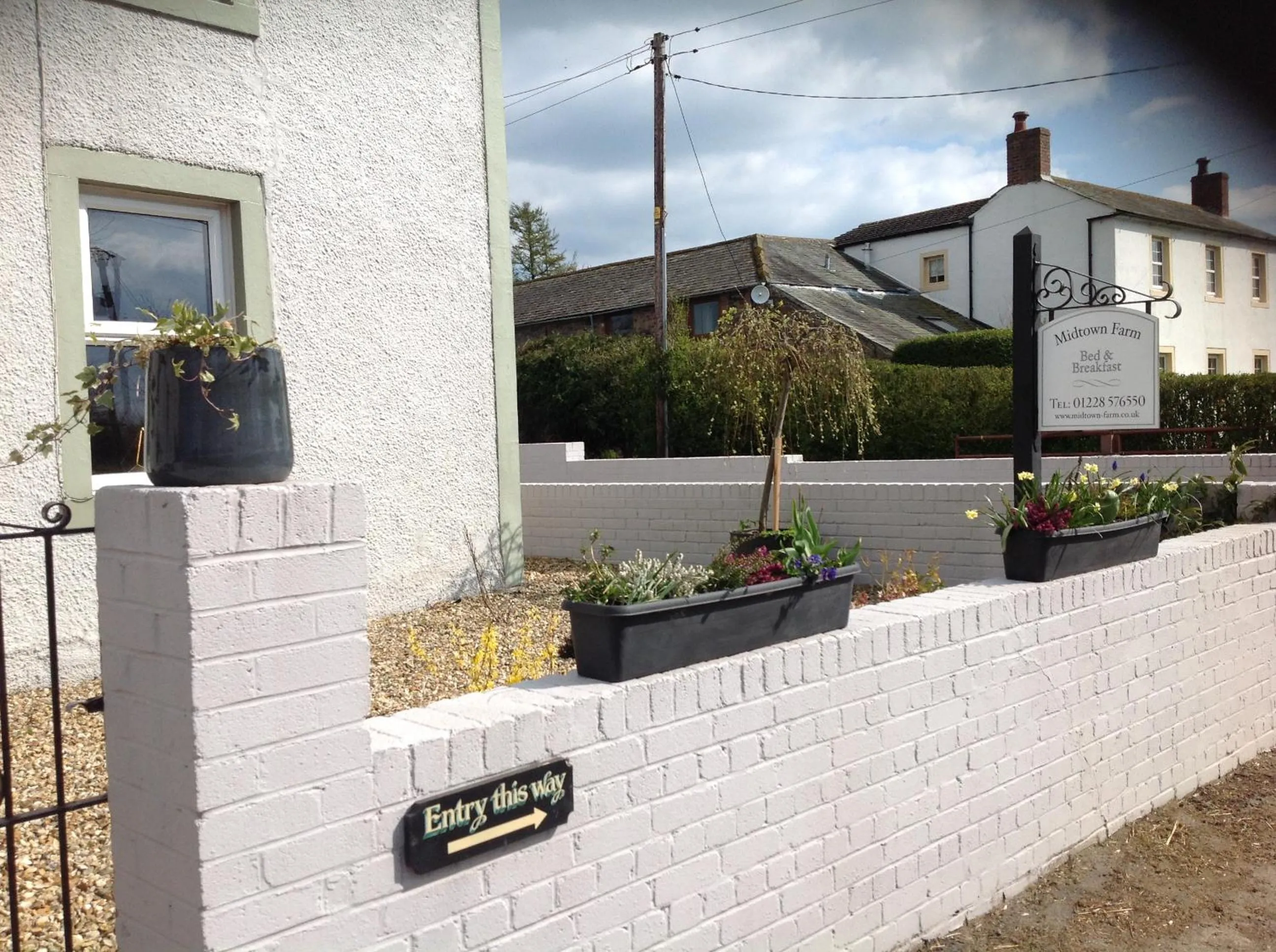 Property logo or sign in Midtown Farm Bed & Breakfast