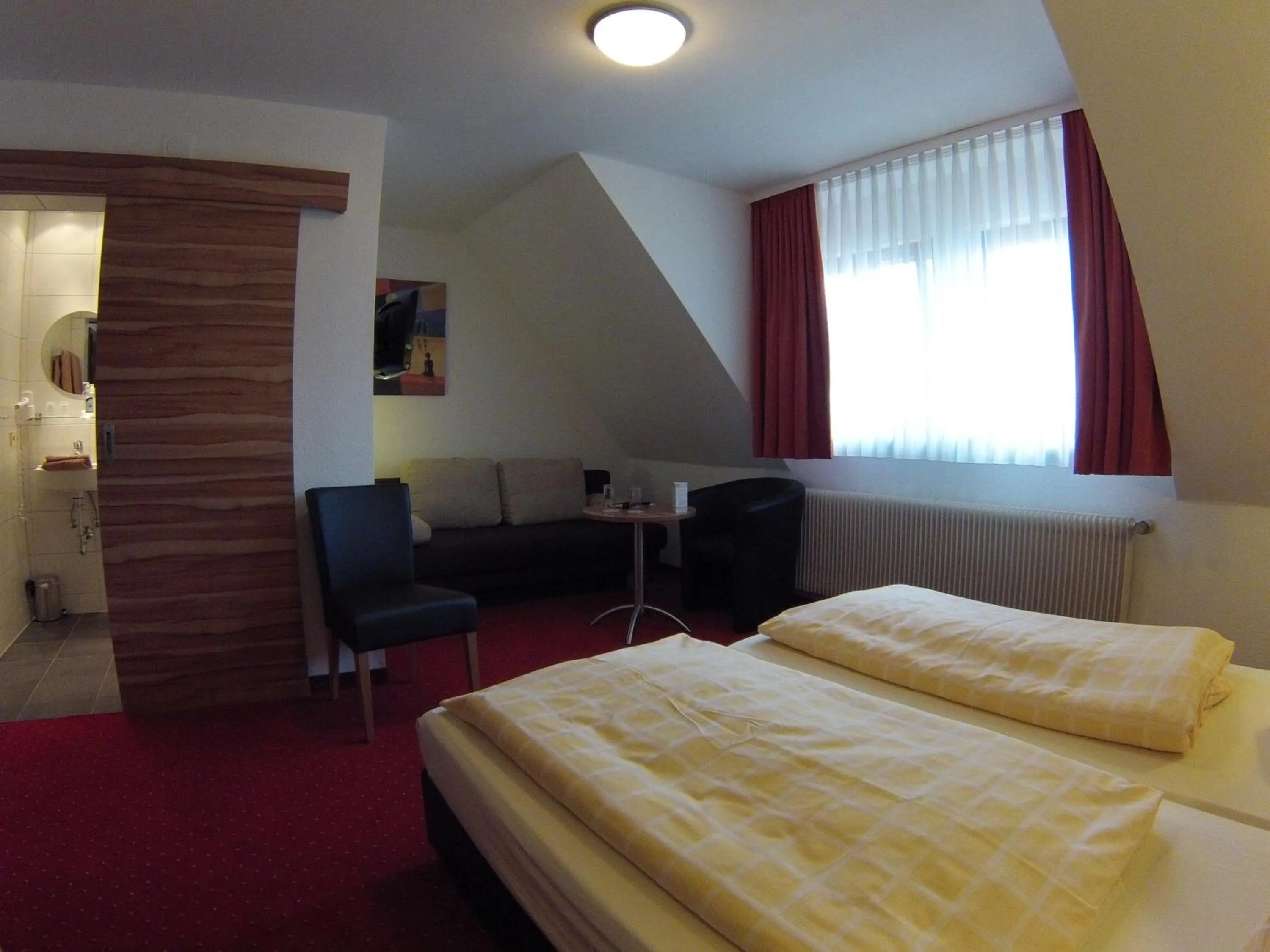 Photo of the whole room, Bed in Hotel KRONE Garni