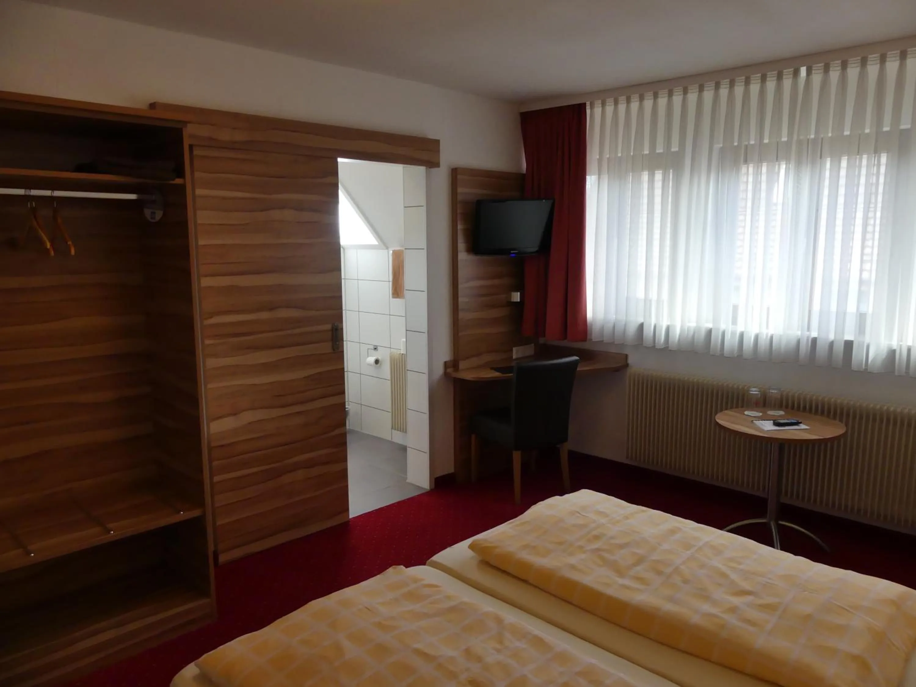 Photo of the whole room, Bed in Hotel KRONE Garni