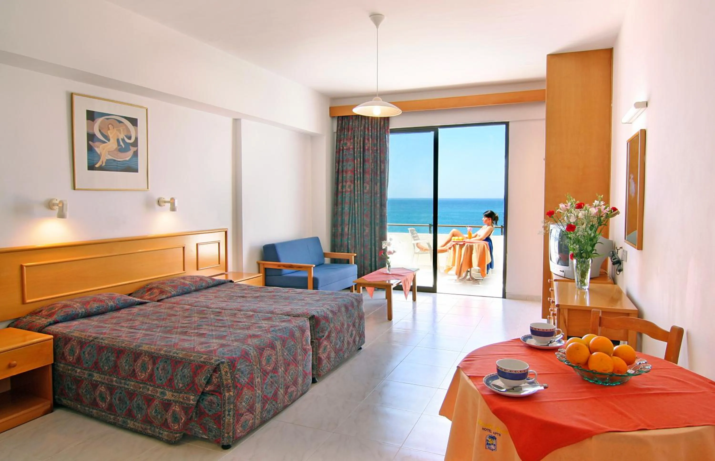 Bed in Corallia Beach Hotel Apartments