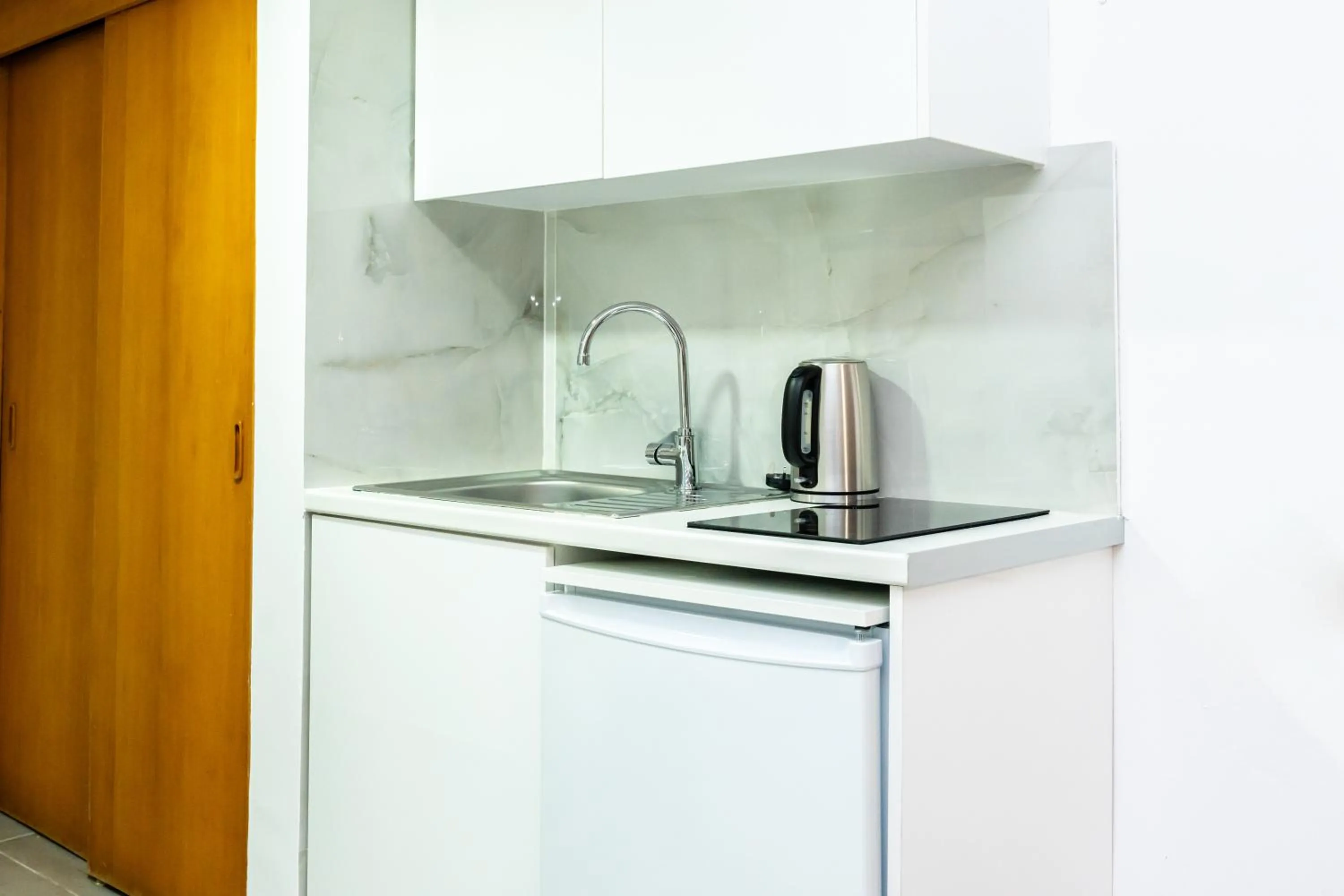 kitchen in Helios Bay Hotel and Suites