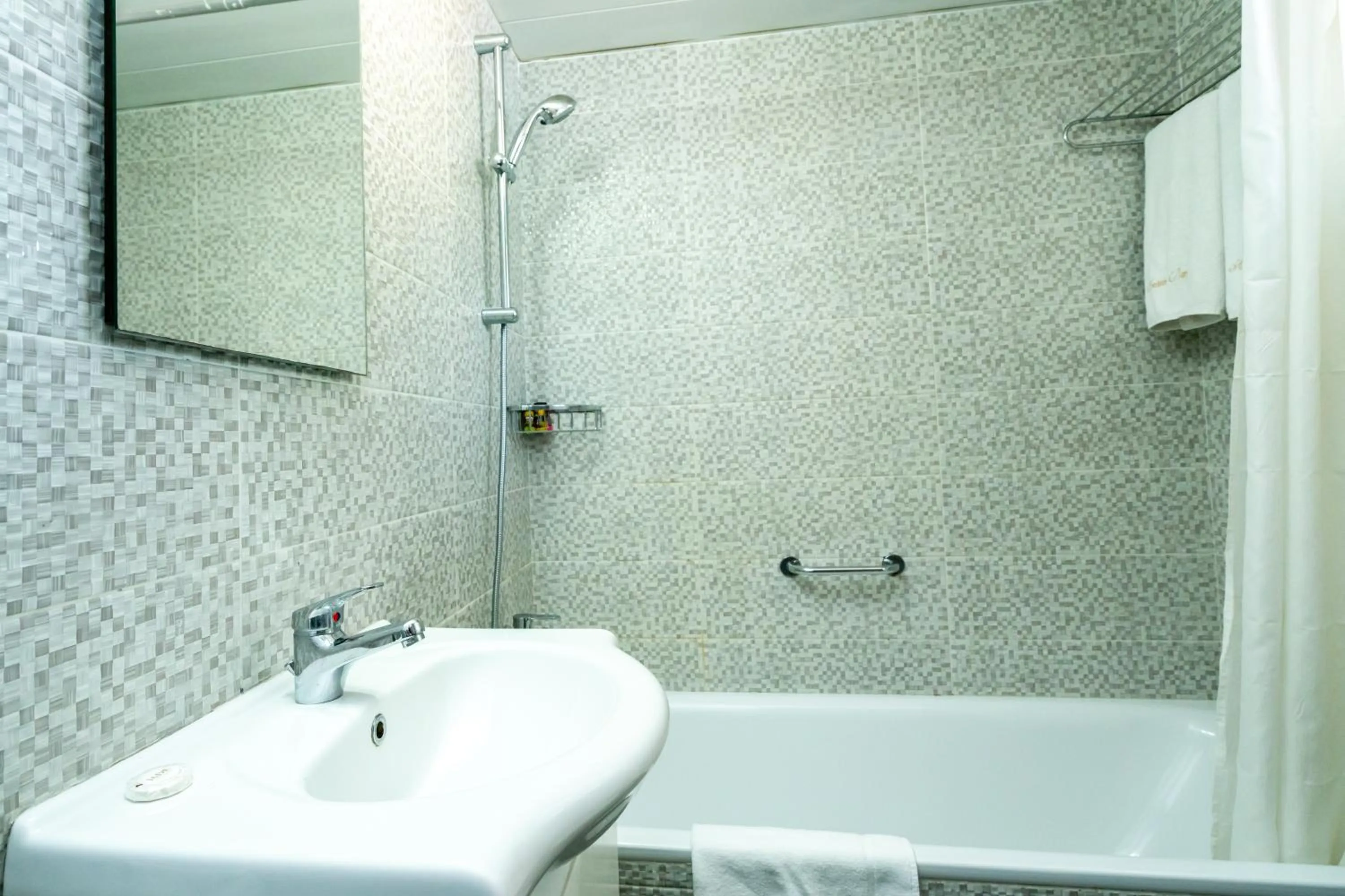 Bathroom in Helios Bay Hotel and Suites