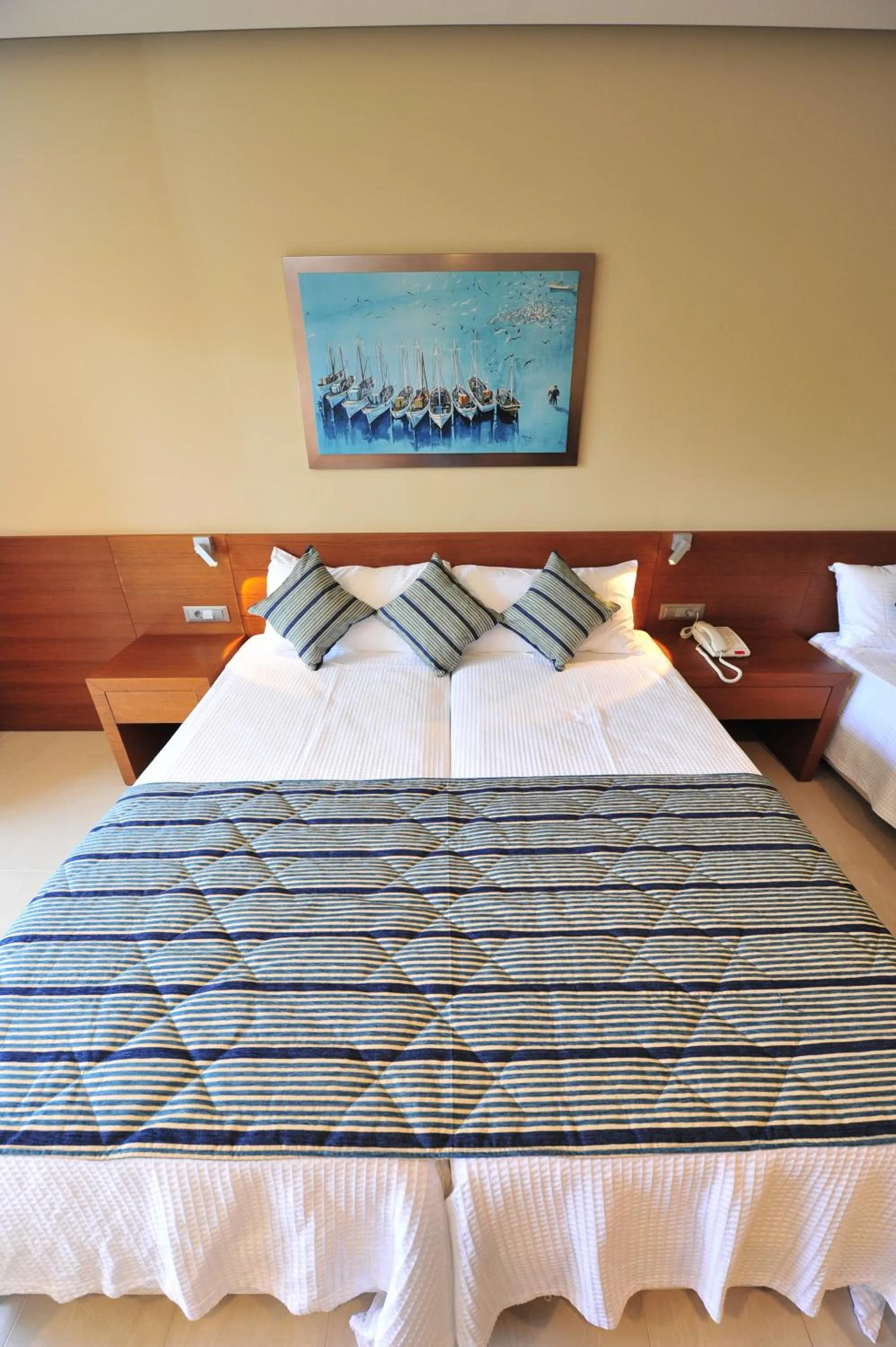 Bed in Apollonion Asterias Resort and Spa