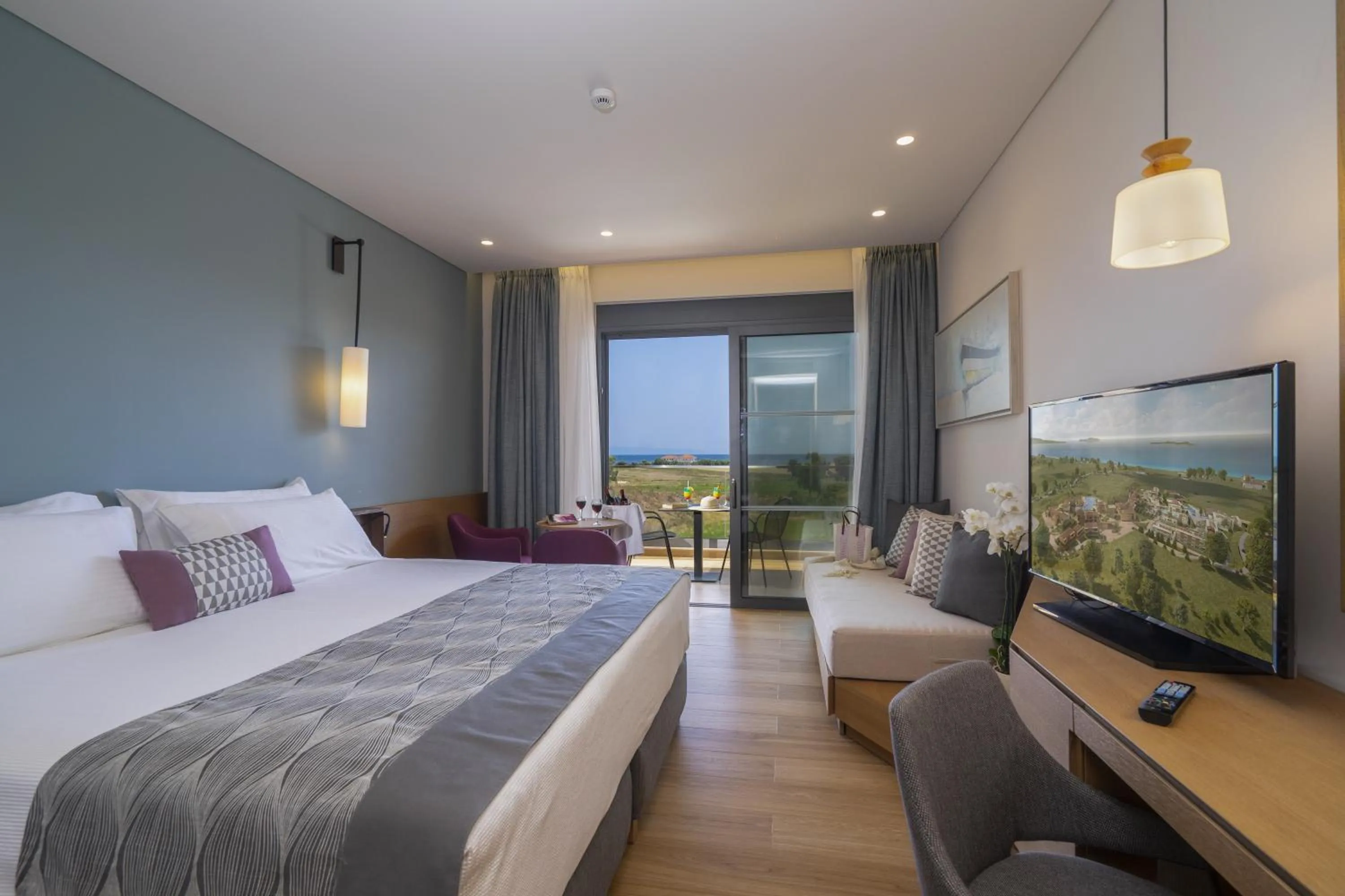 Seating area, Bed in Apollonion Asterias Resort and Spa